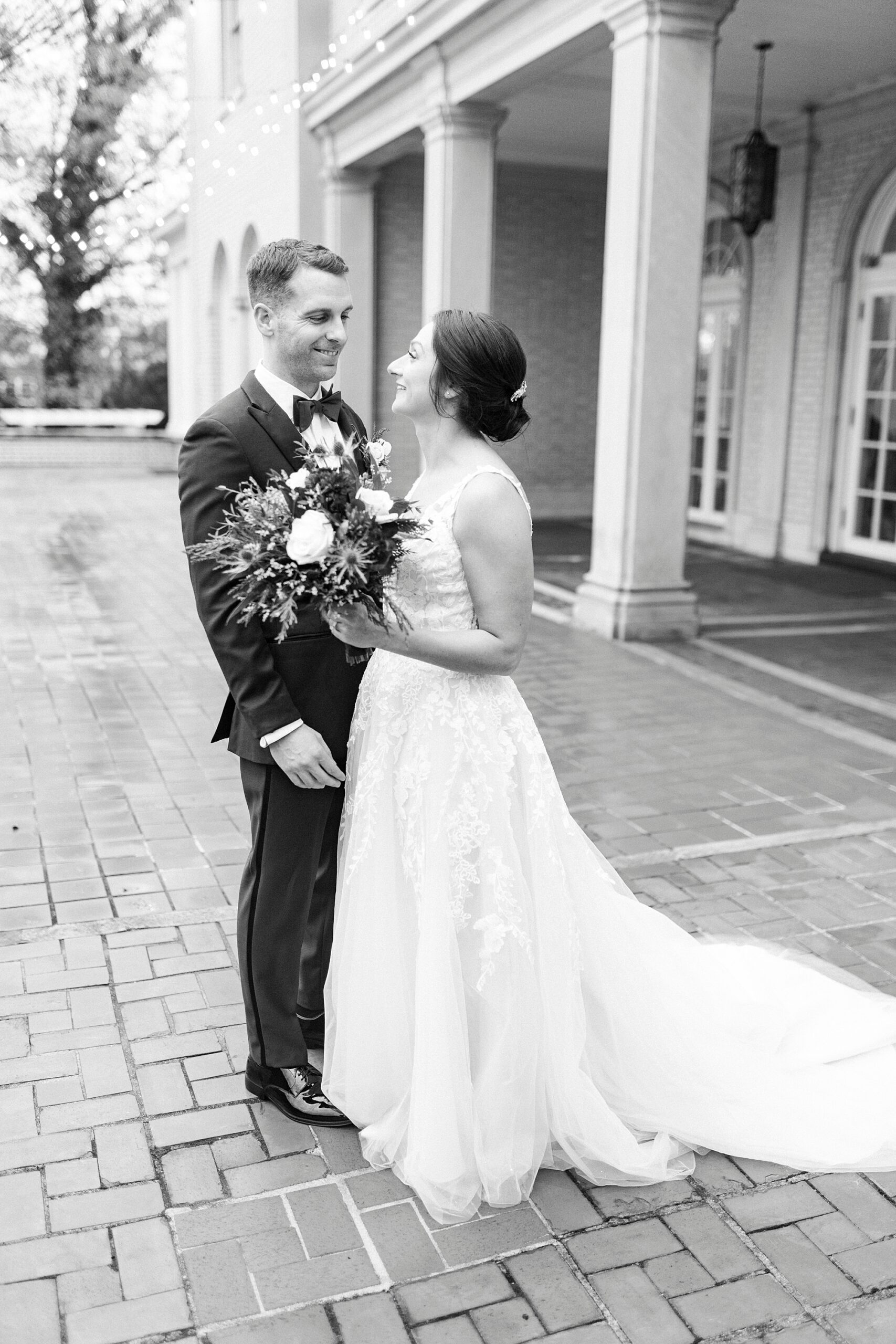 bride and groom smile together on the patio at Separk Mansion