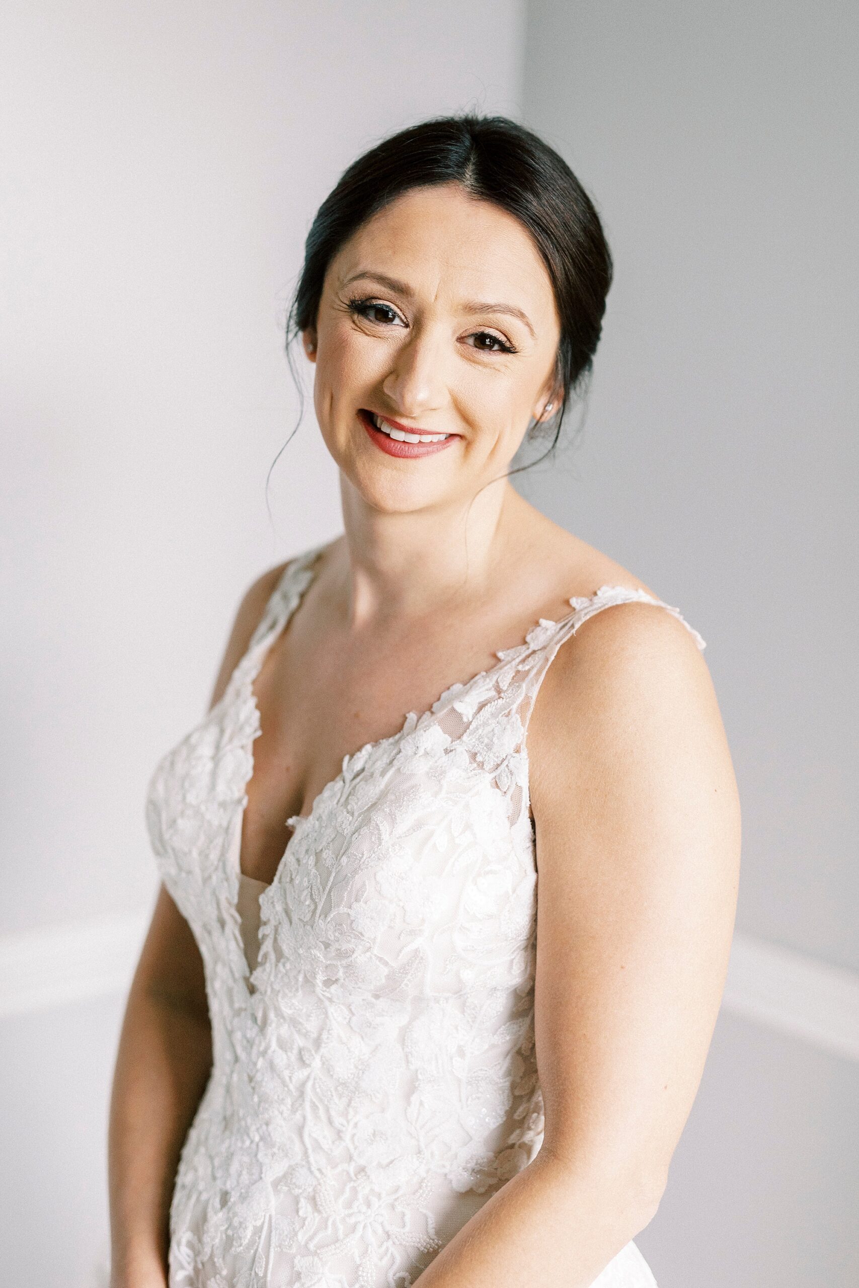 bride smiles tilting head to the side inside bridal suite at Separk Mansion