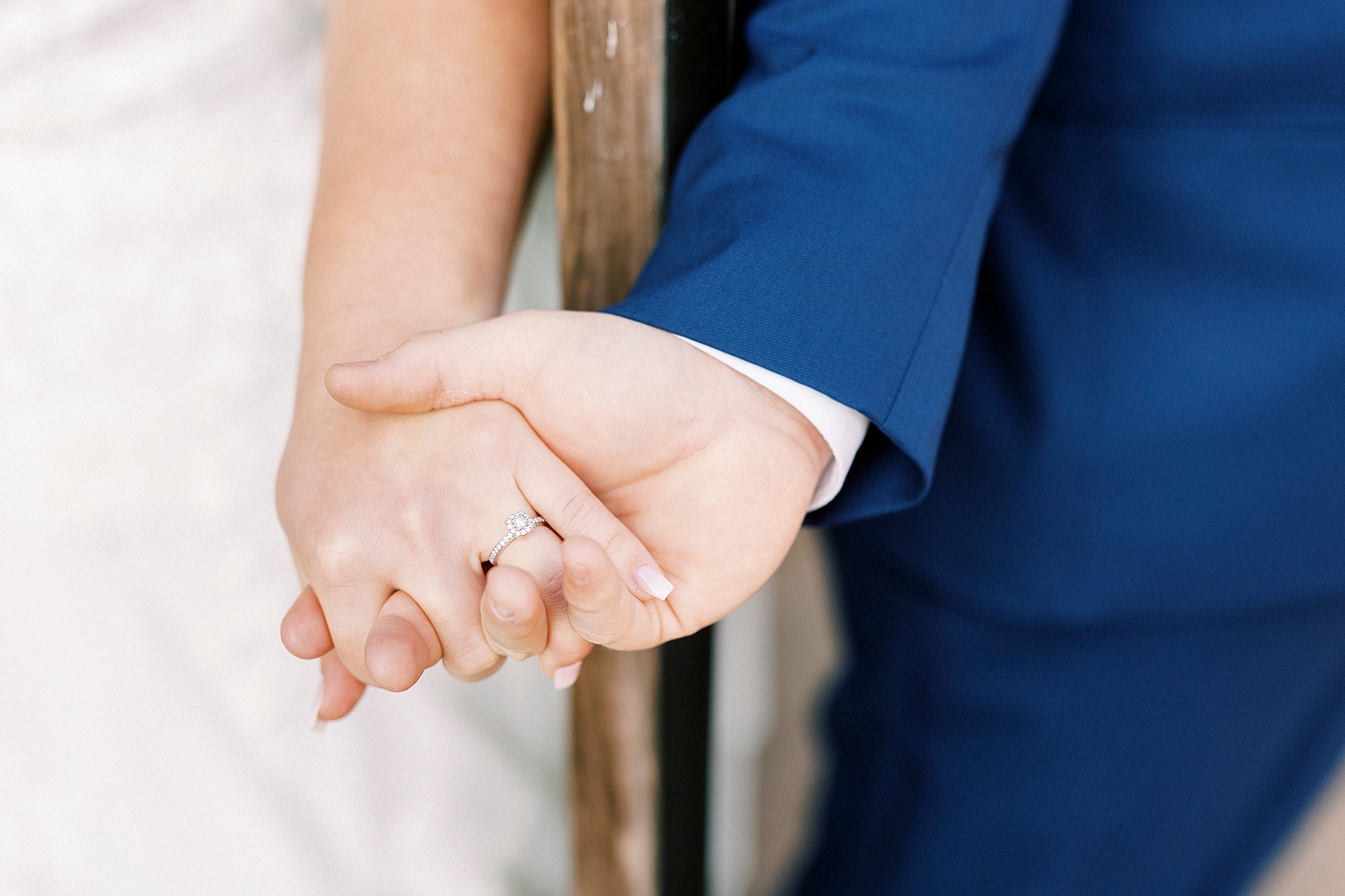 bride and groom hold hands during fall wedding day at the Farm at Brusharbor