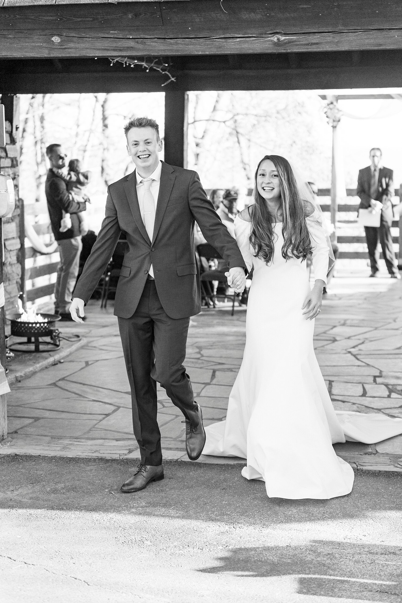 bride and groom smile leaving early morning ceremony on Morrow Mountain