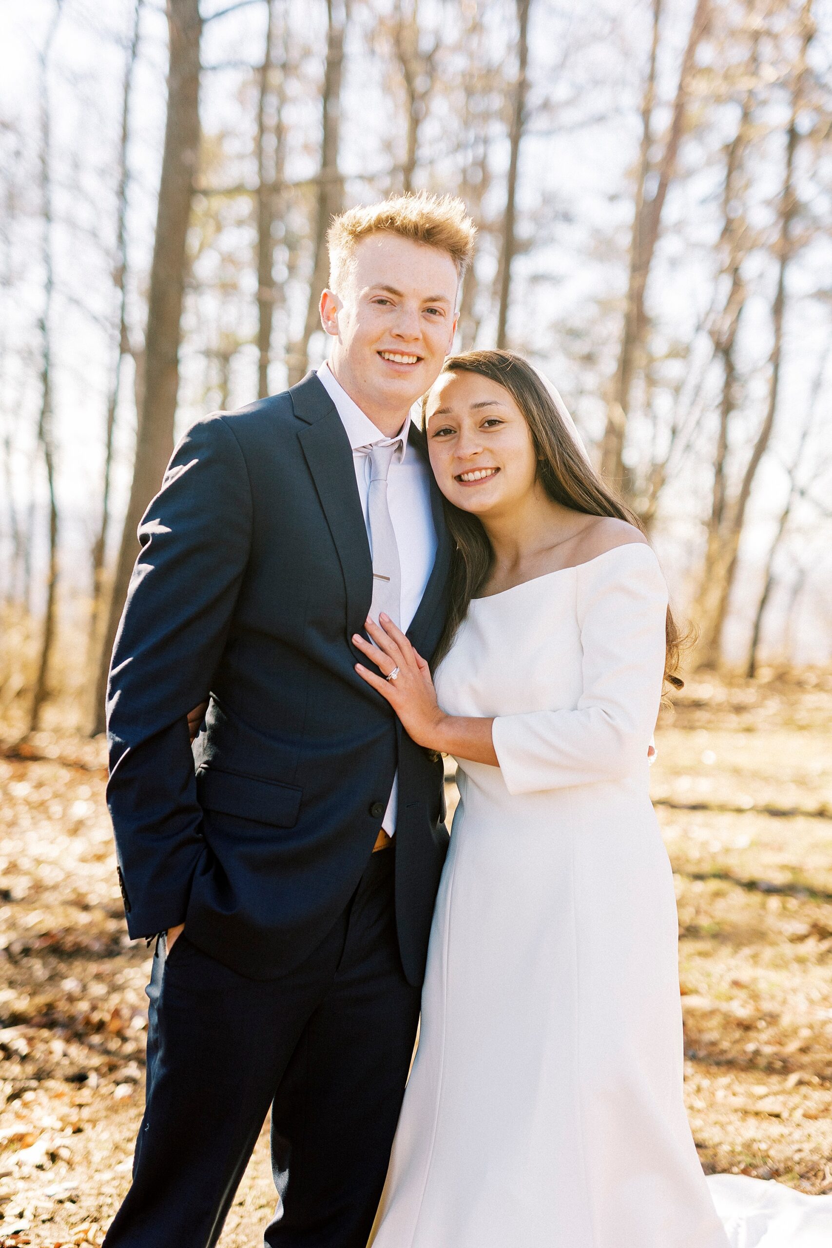 bride hugs groom during early morning wedding on Morrow Mountain
