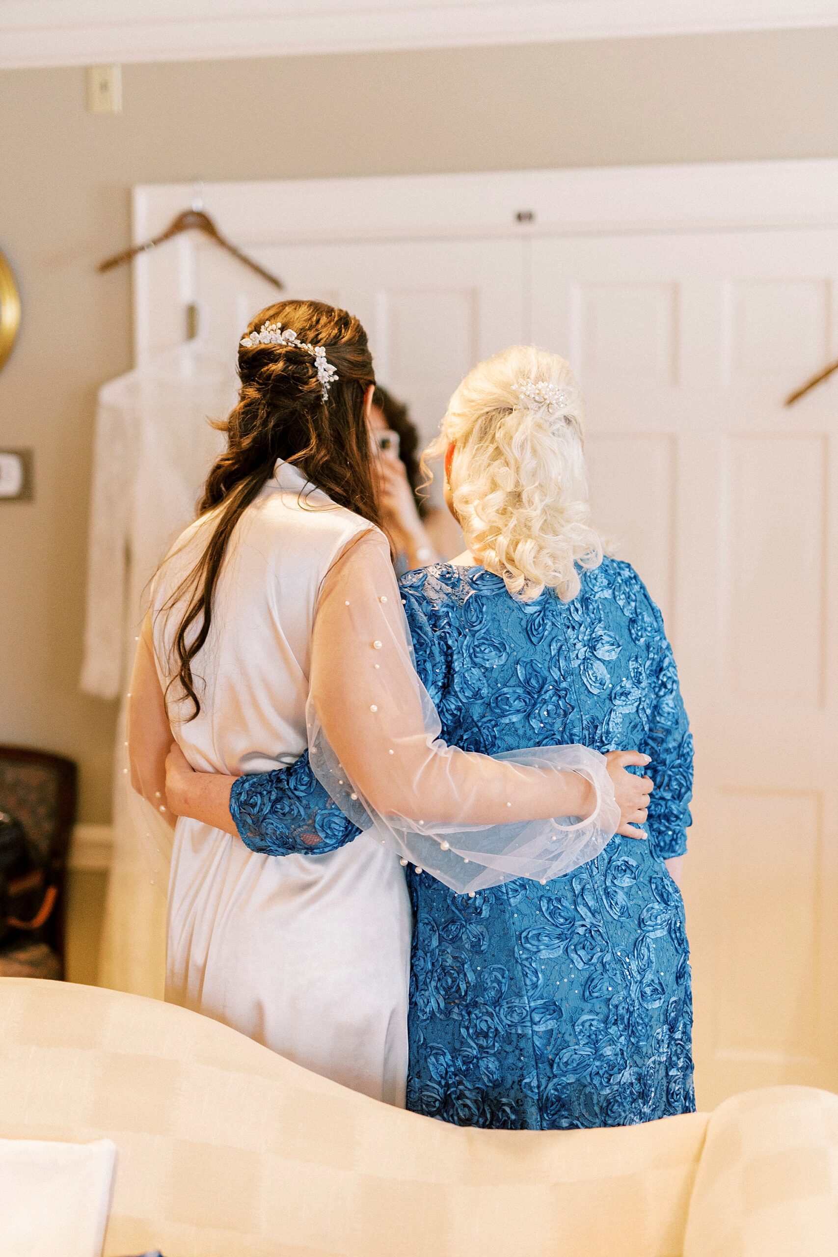 bride and mother hug before Downtown Kannapolis wedding