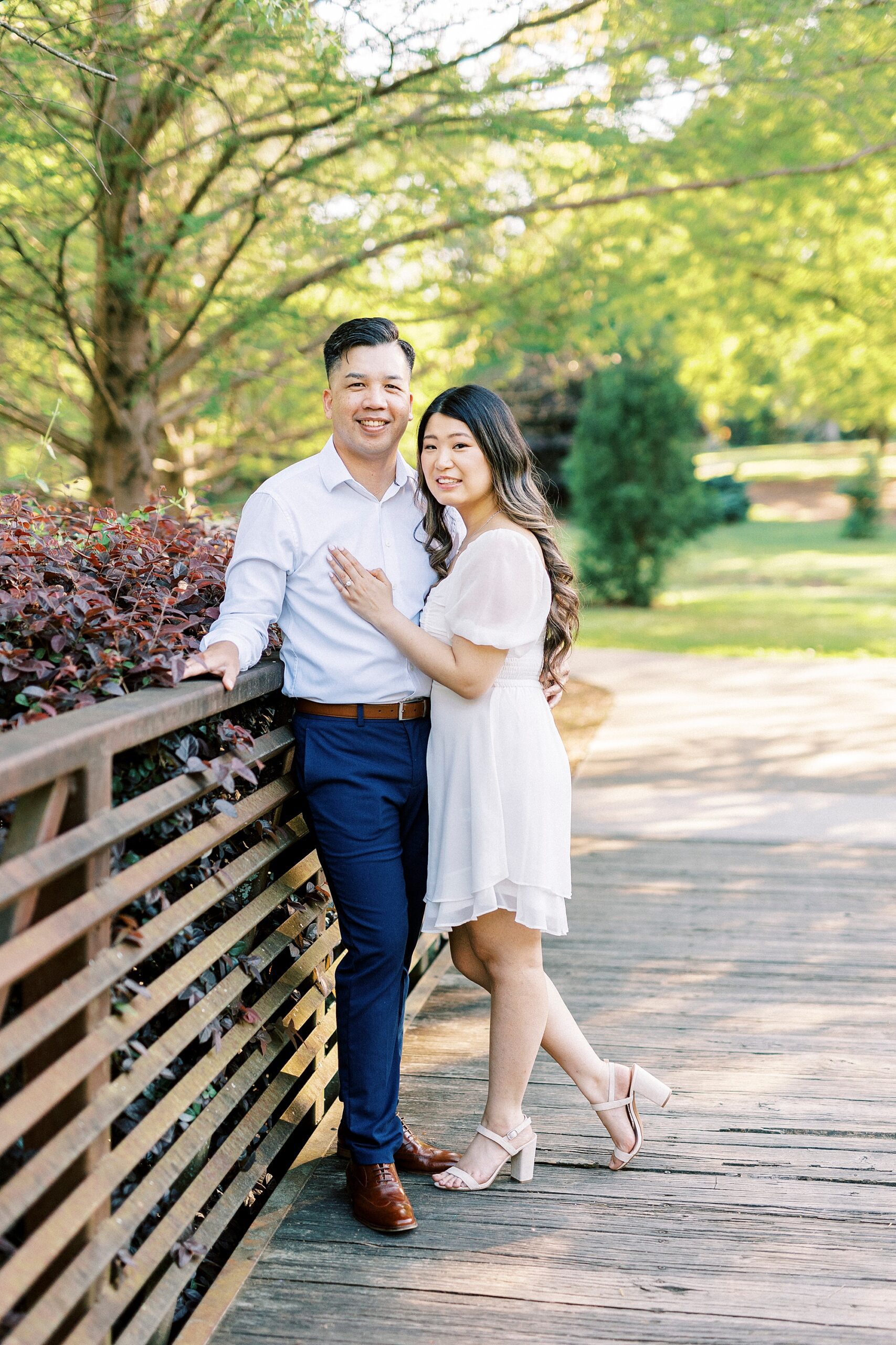 woman hugs man leaning into his arms at Glencairn Garden