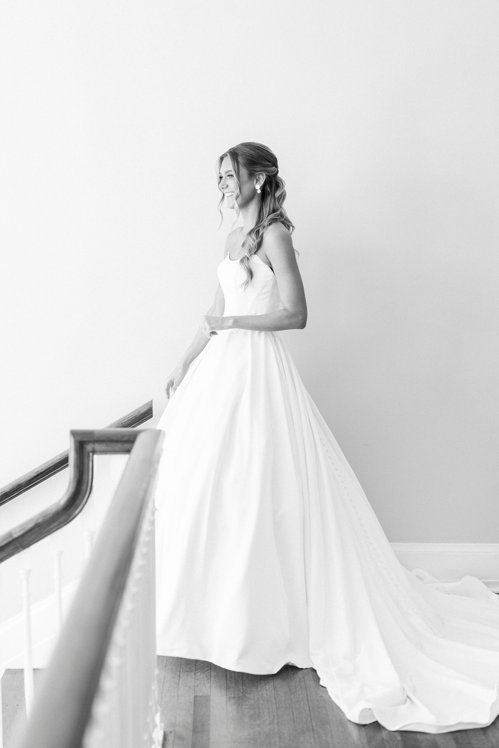 bride stands at the top of the staircase inside Separk Mansion