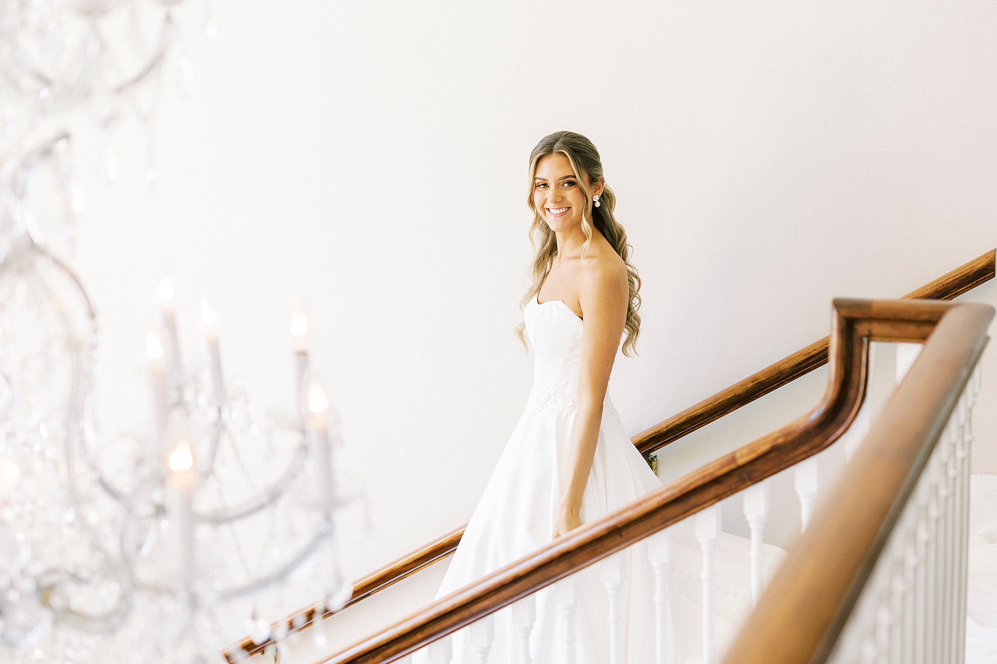 bride walks down staircase inside Separk Mansion