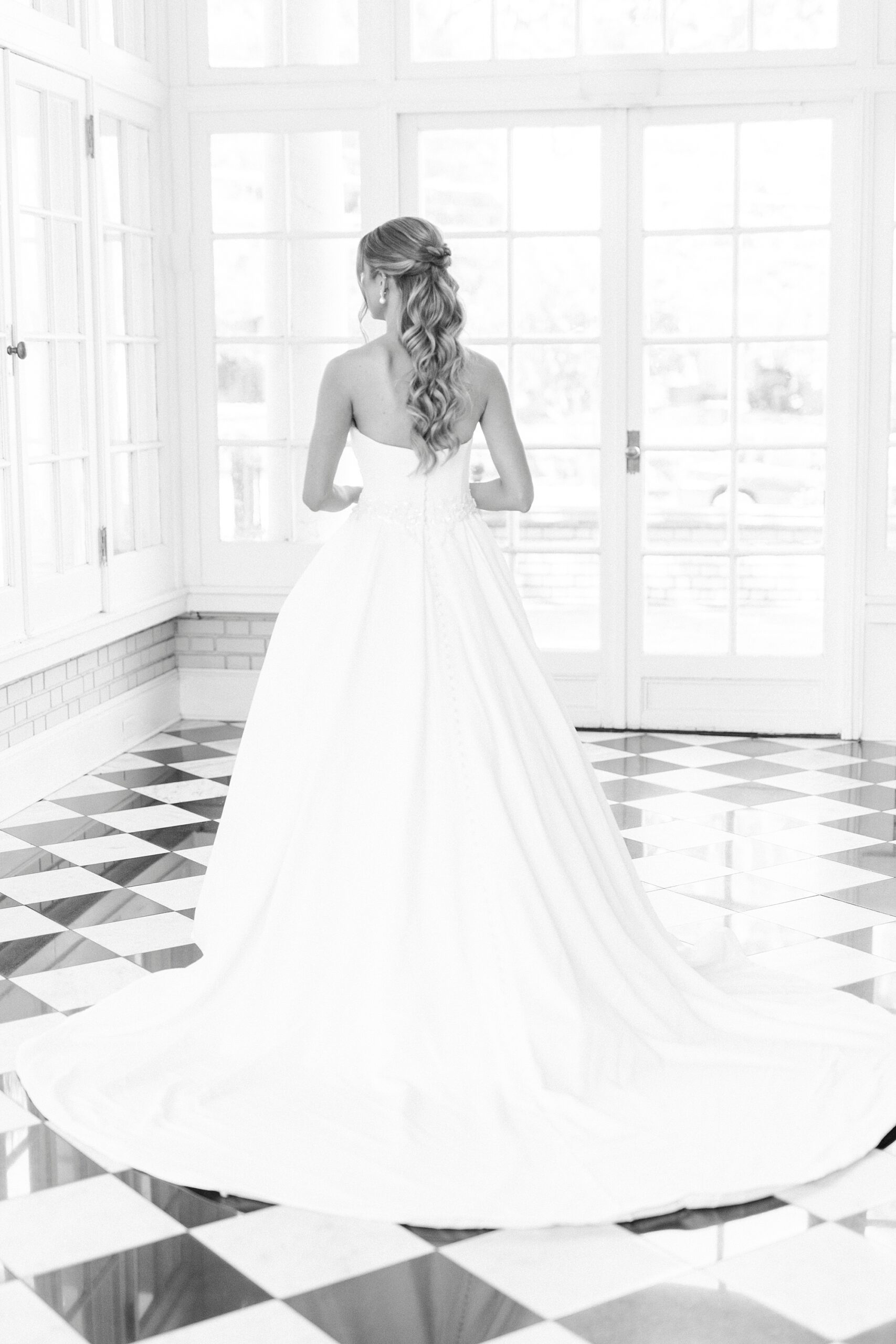 bride turns walking on black and white floor at Separk Mansion