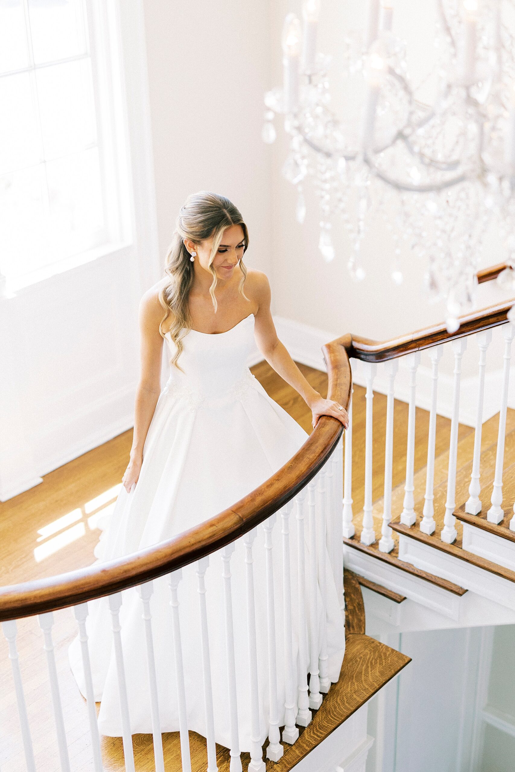bride walks up staircase inside Separk Mansion