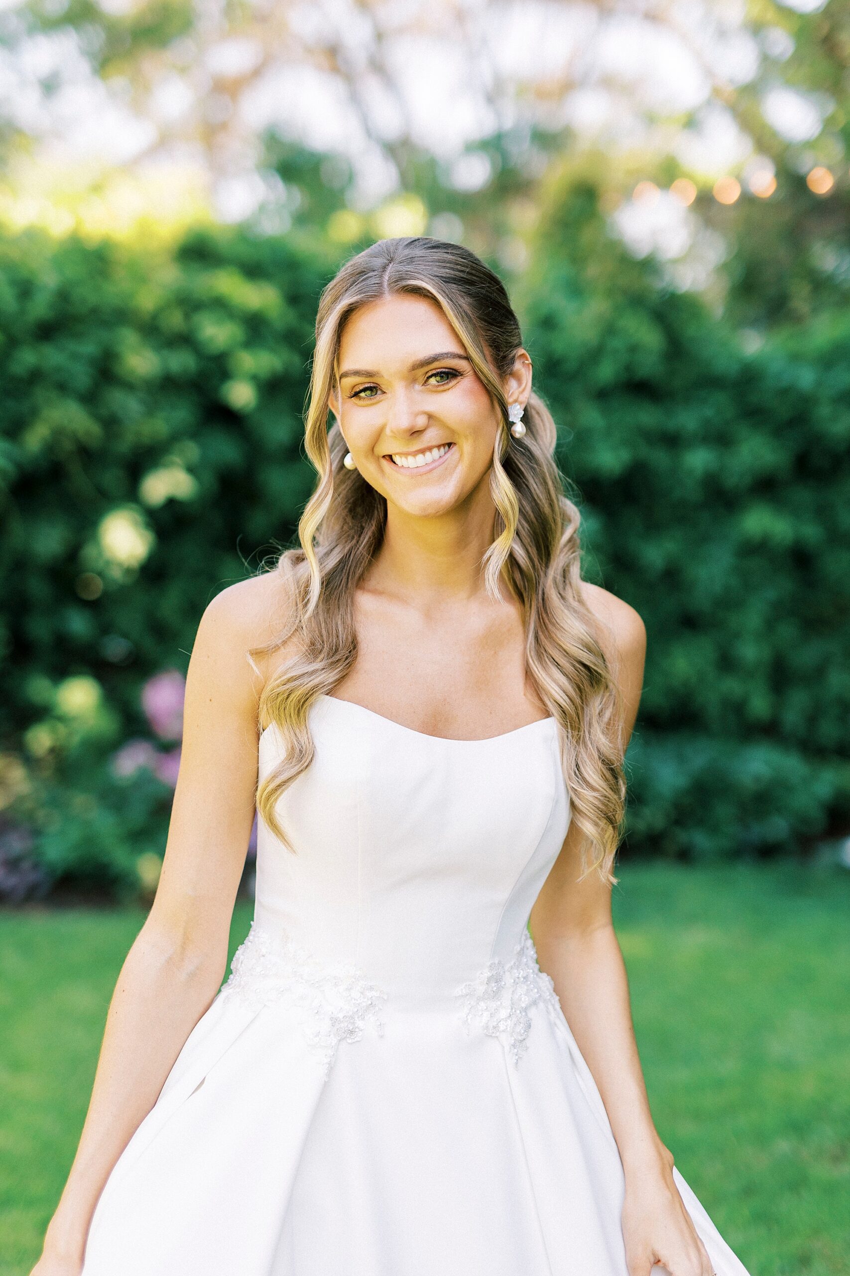bride grins with trulls around her shoulders during classic  bridal portraits at Separk Mansion