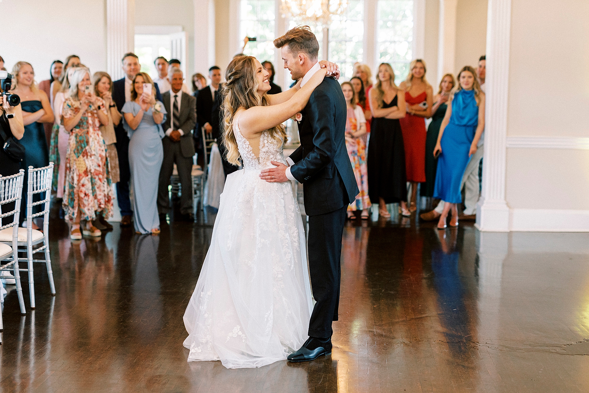 newlyweds dance inside Charlotte NC wedding venue
