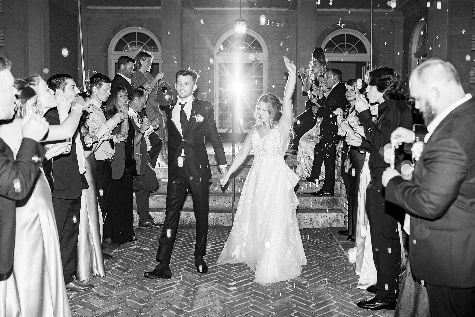 bride and groom cheer walking through exit tunnel at Separk Mansion