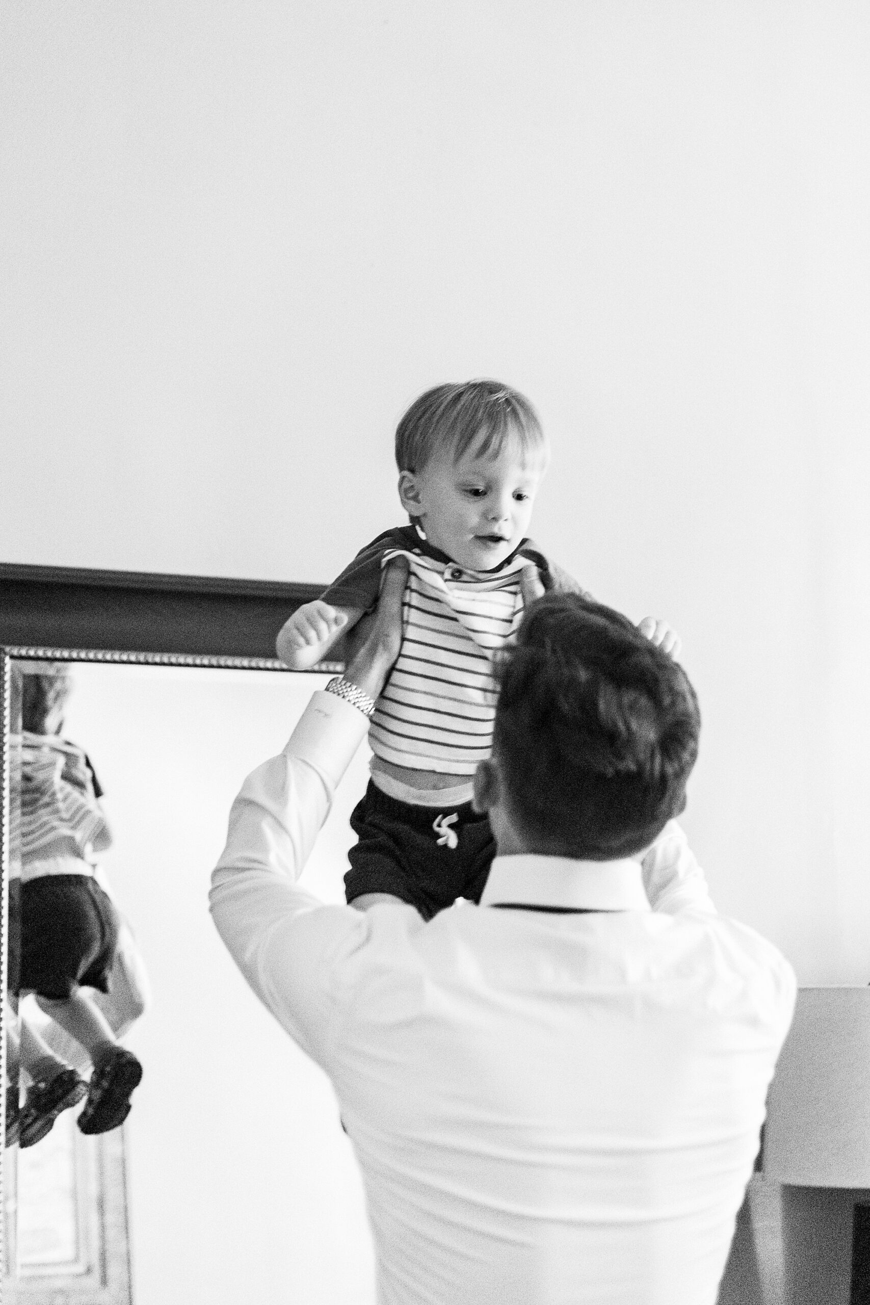 groom lifts up son in suite at Separk Mansion