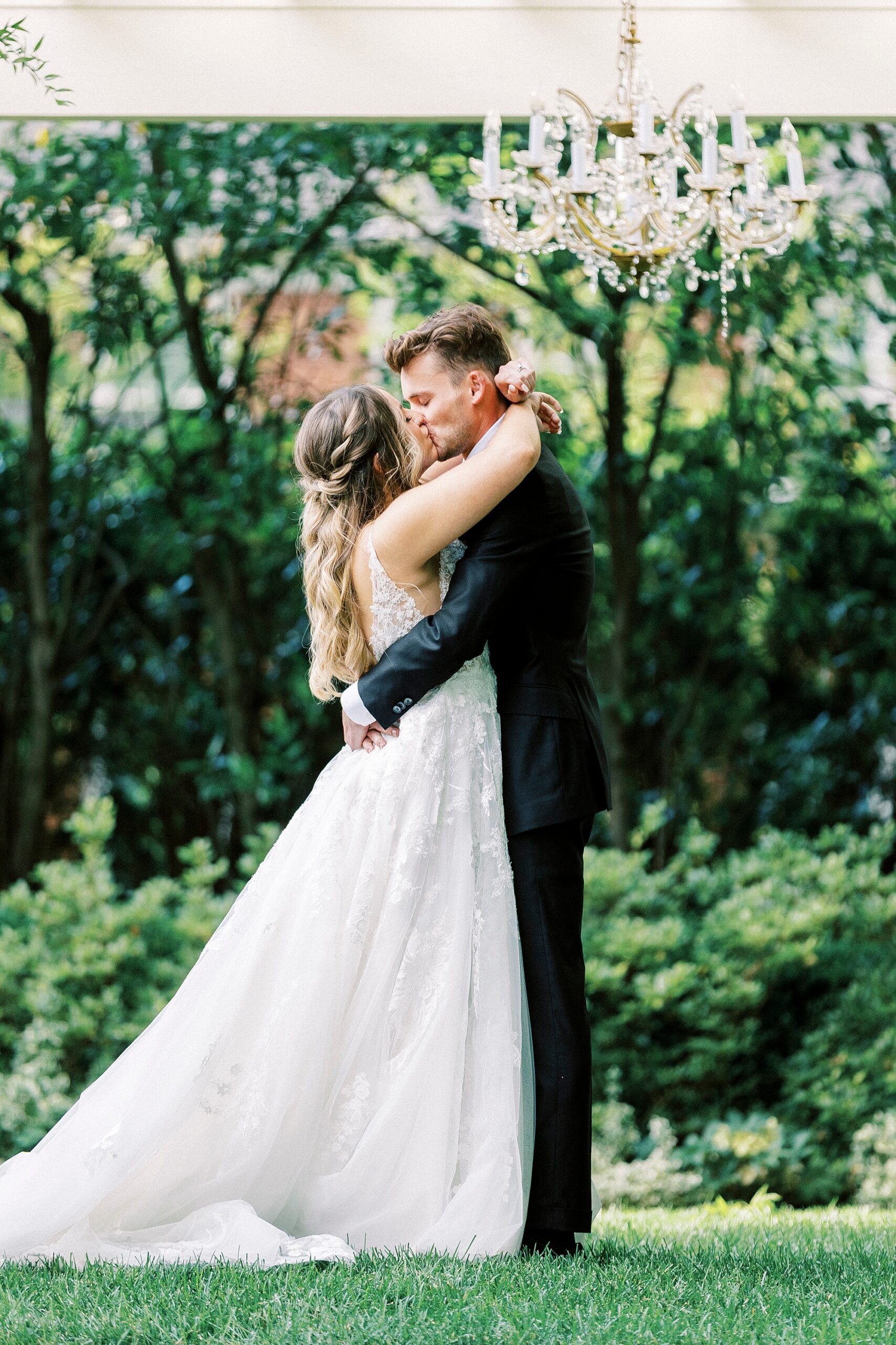newlyweds kiss during garden wedding ceremony at Separk Mansion