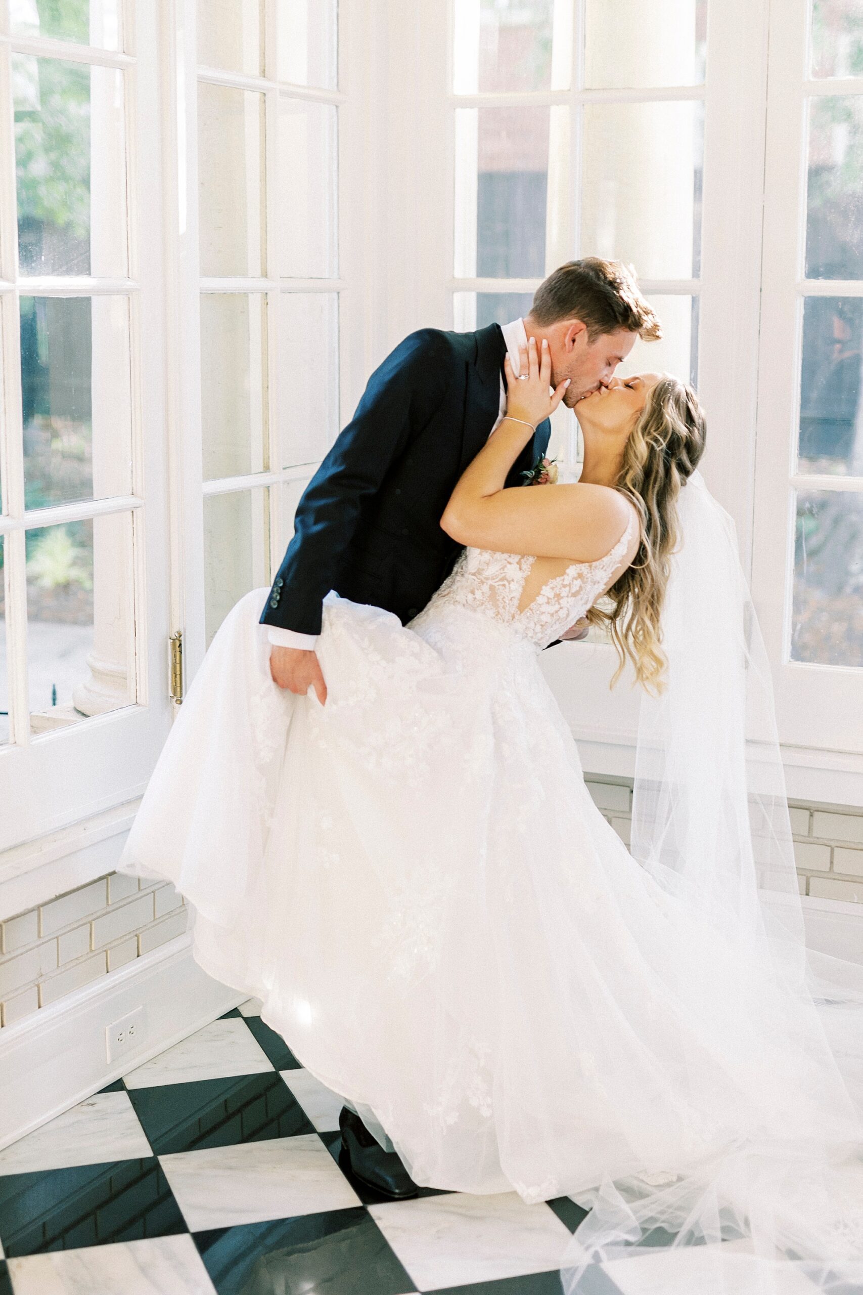 bride and groom kiss dipping inside Separk Mansion
