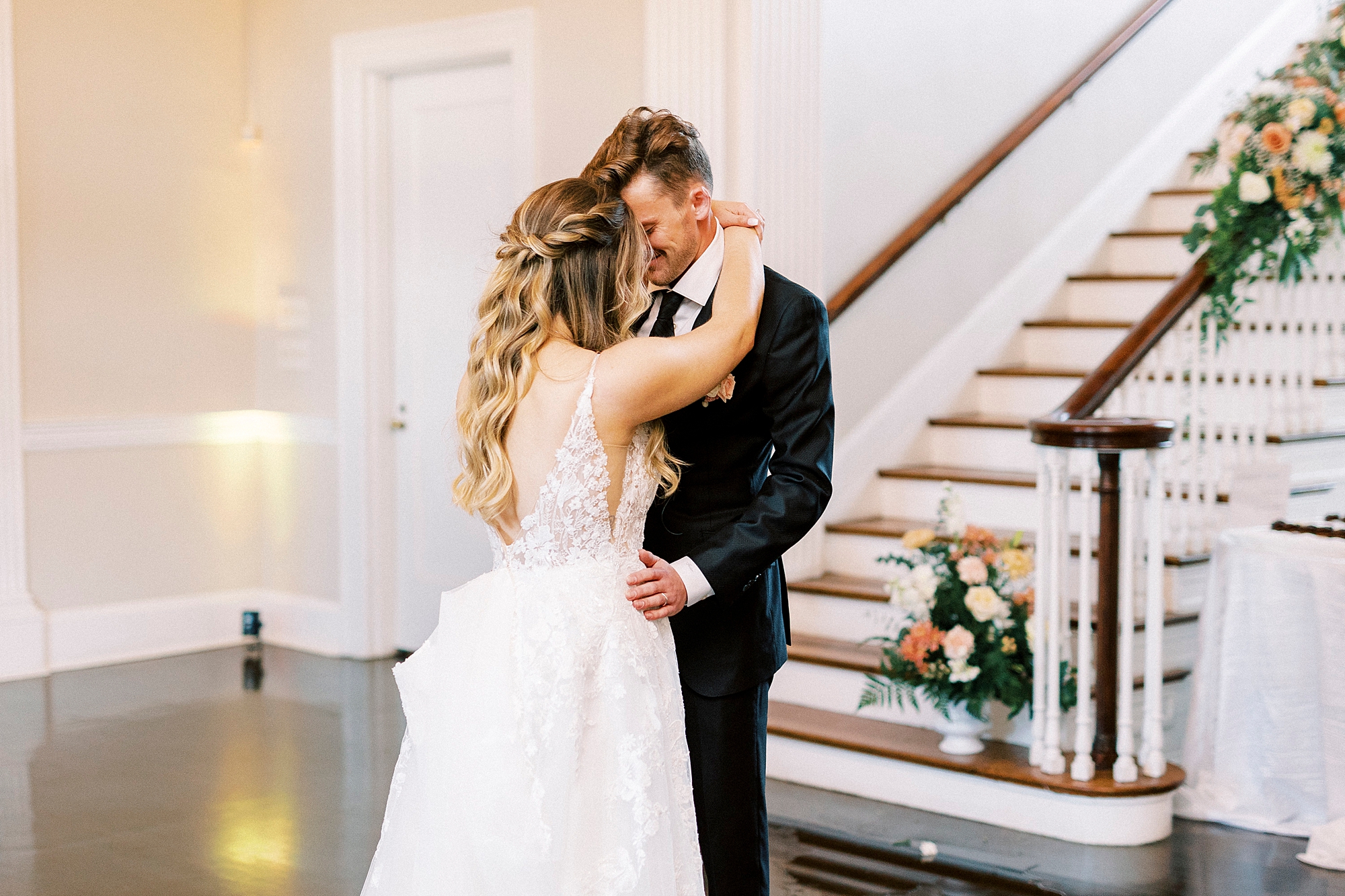 newlyweds hug during reception dance at Separk Mansion