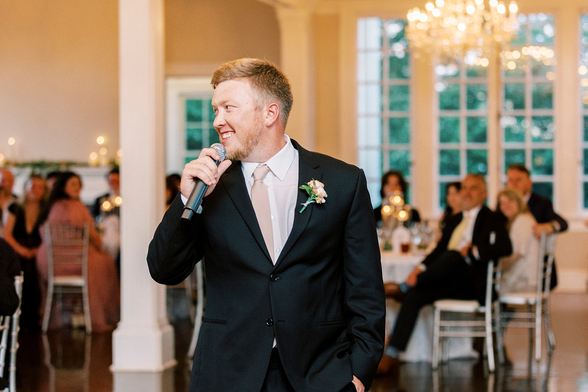 man gives speech during Charlotte NC wedding reception 