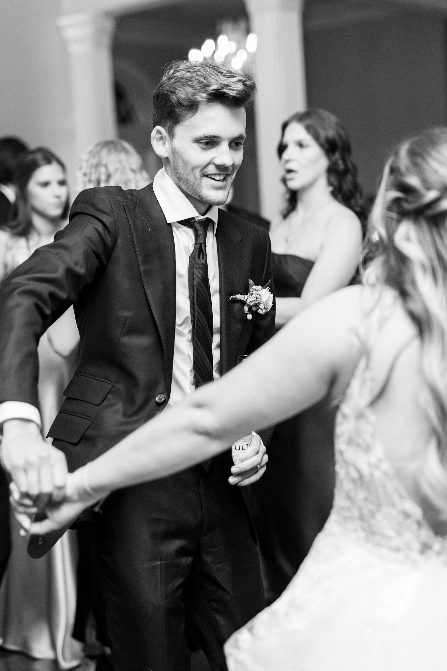 groom dances with bride during Charlotte NC wedding reception
