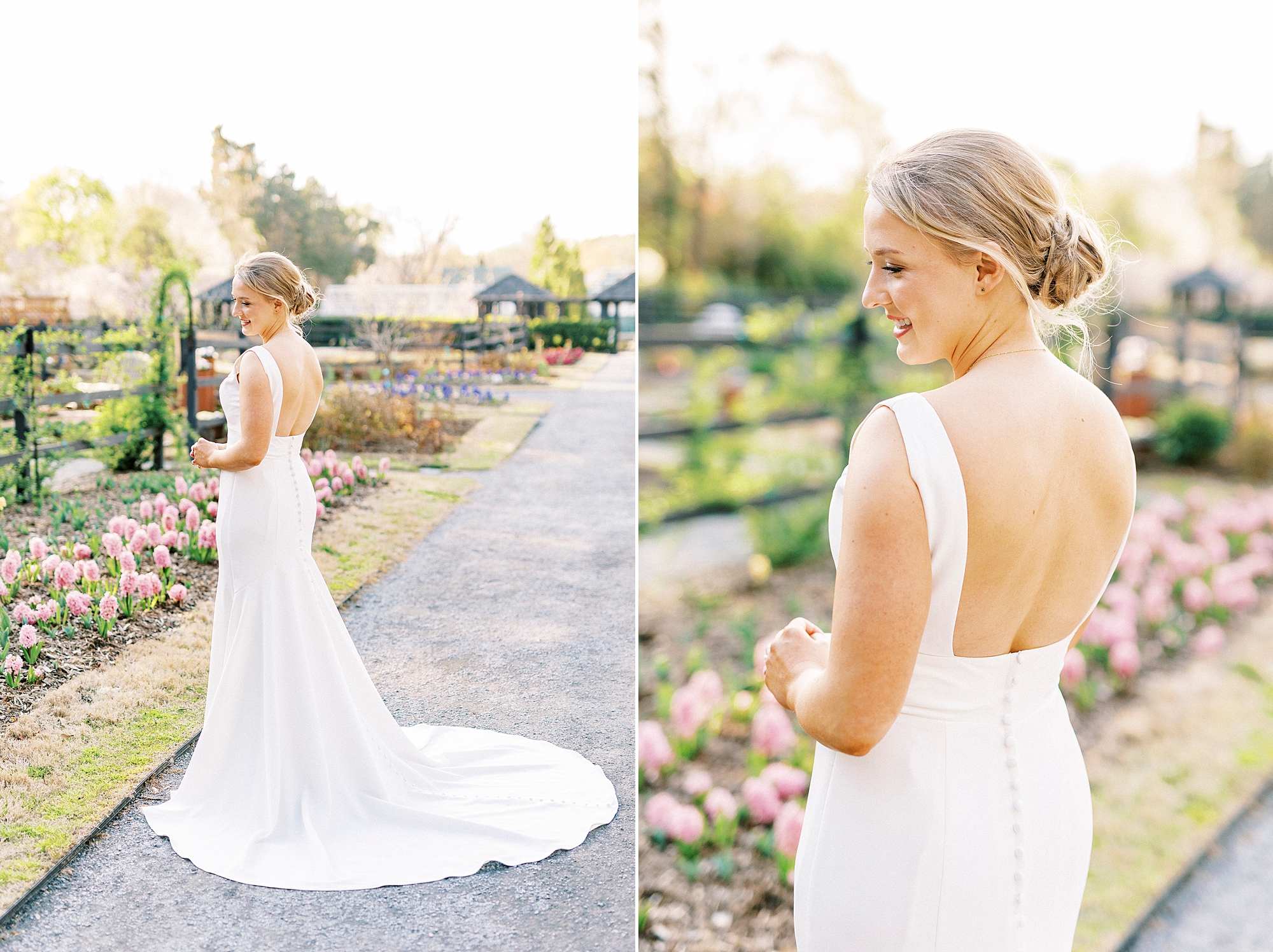 bride smiles in row of flowers showing off the back of her wedding gown