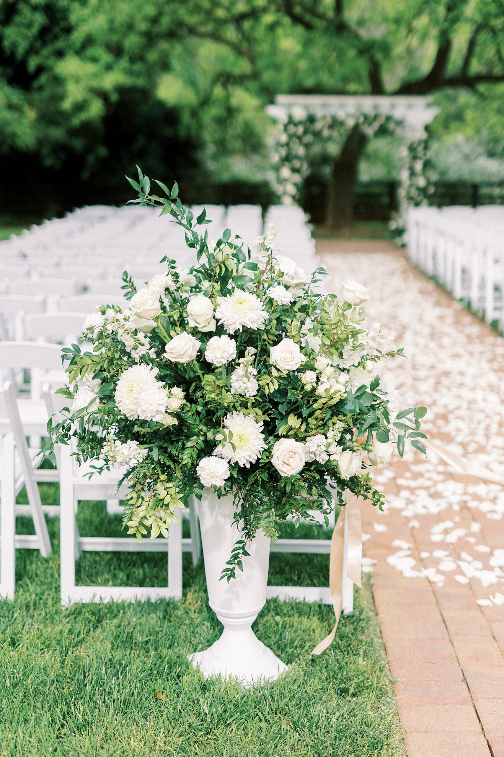 white flowers line aisle at the Venues at Langtree
