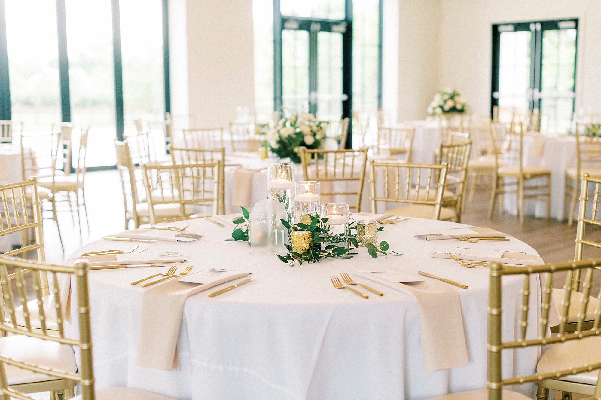 elegant spring wedding reception at the Venues at Langtree with white and gold accents