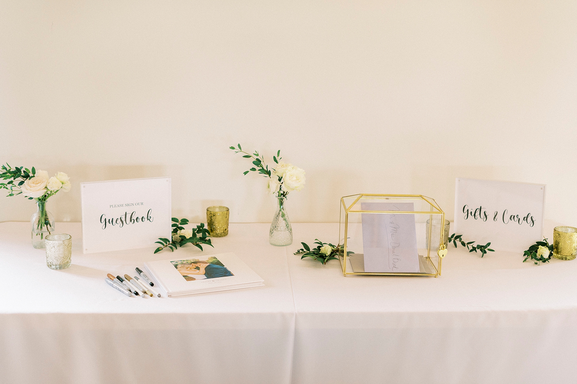 gift table with gold box and white roses