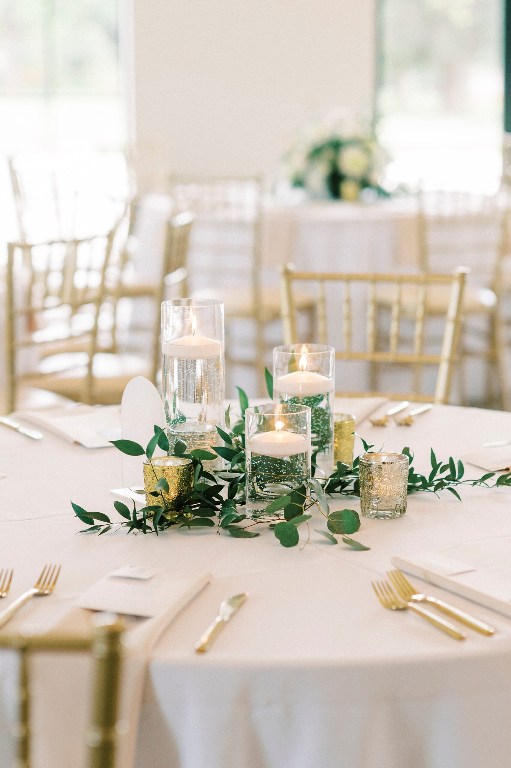 reception table with candles and greenery at the Venues at Langtree