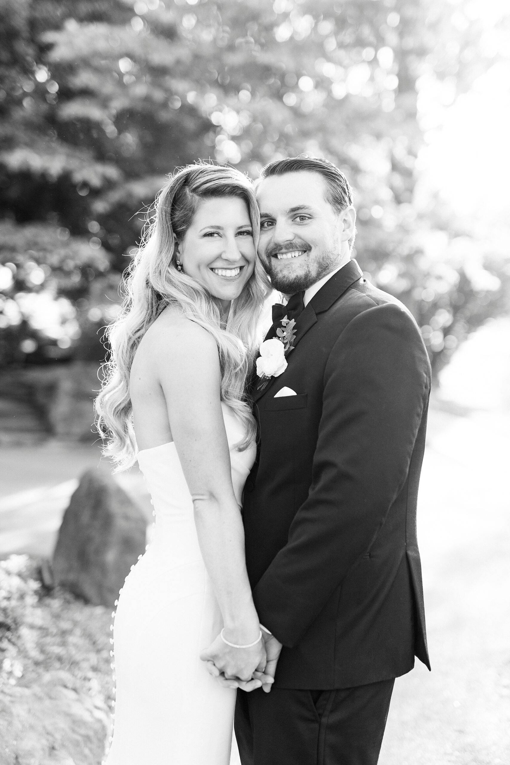 black and white photo of bride and groom leaning heads together at the Venues at Langtree