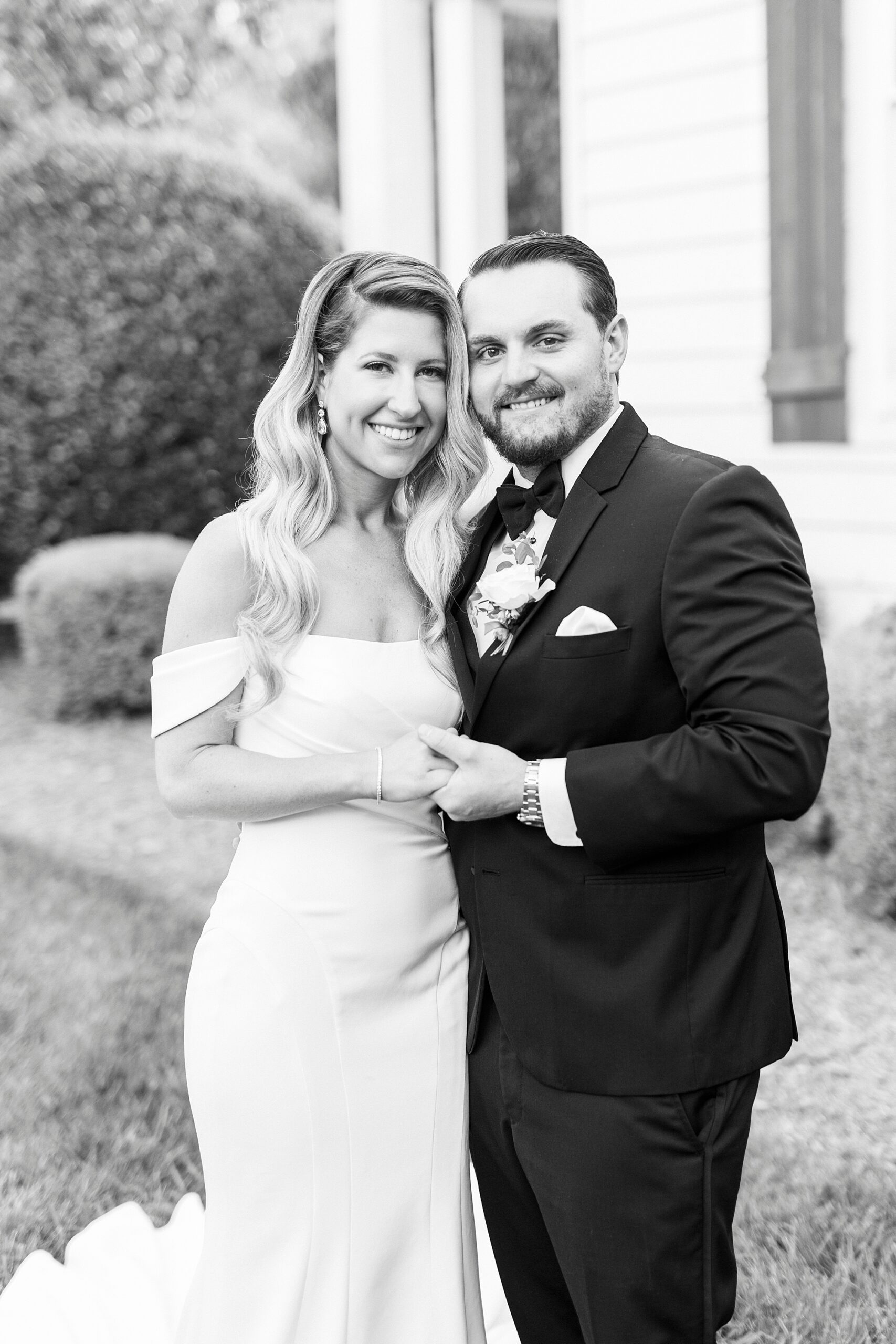 newlyweds hug together leaning heads into each other