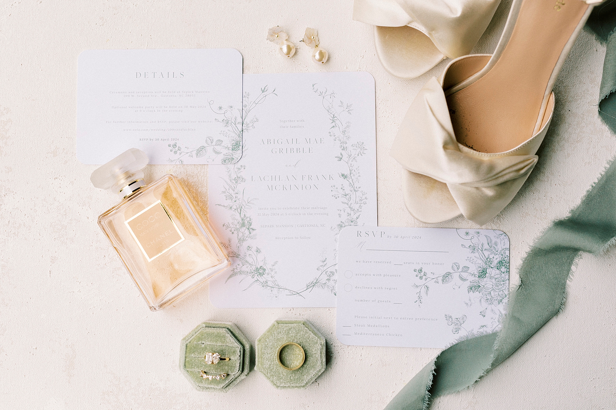 jewelry in sage green boxes and invitation suite for classy spring wedding