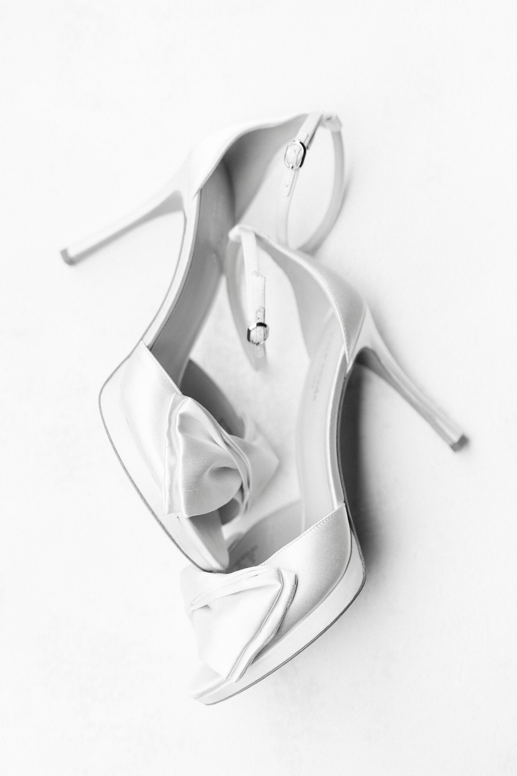 bride's white satin shoes for spring wedding