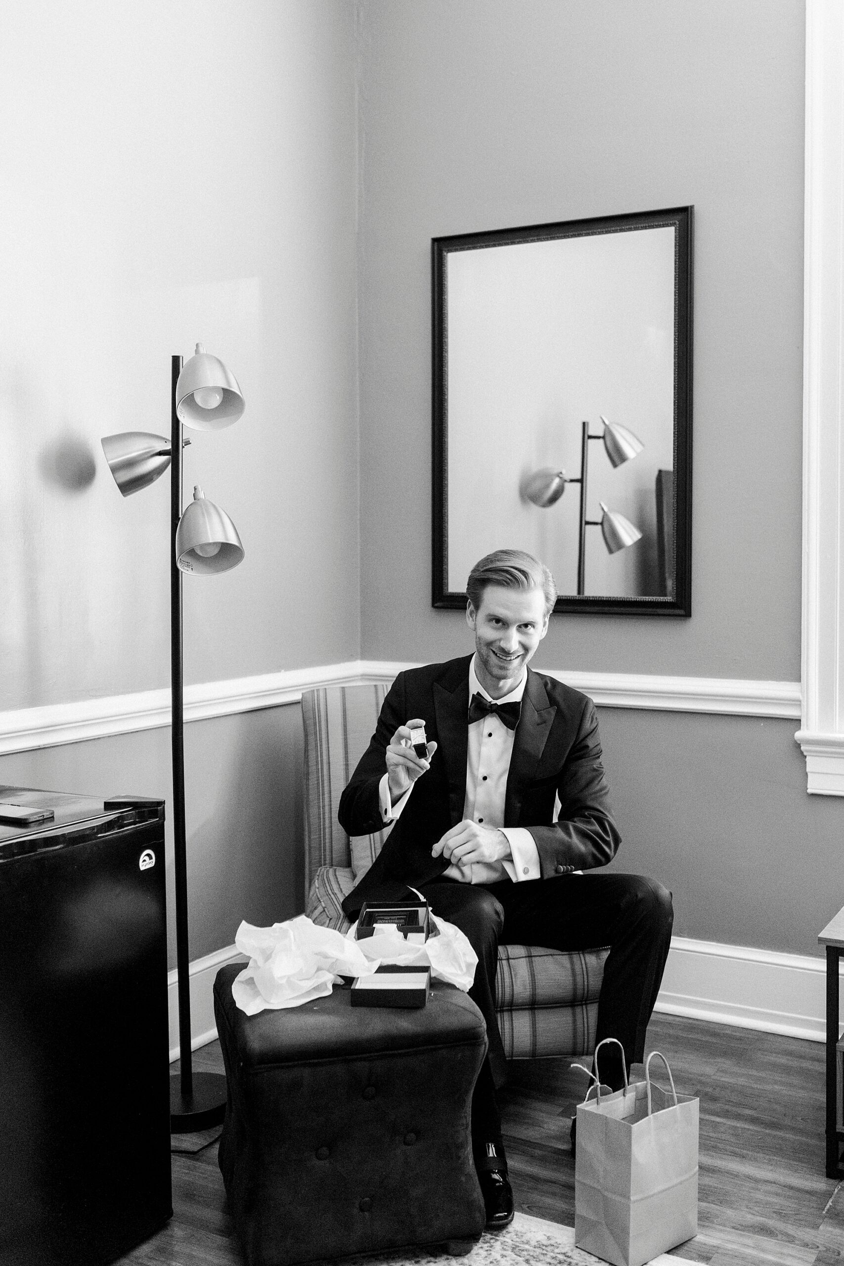 groom opens gift in groom's suite at Separk Mansion
