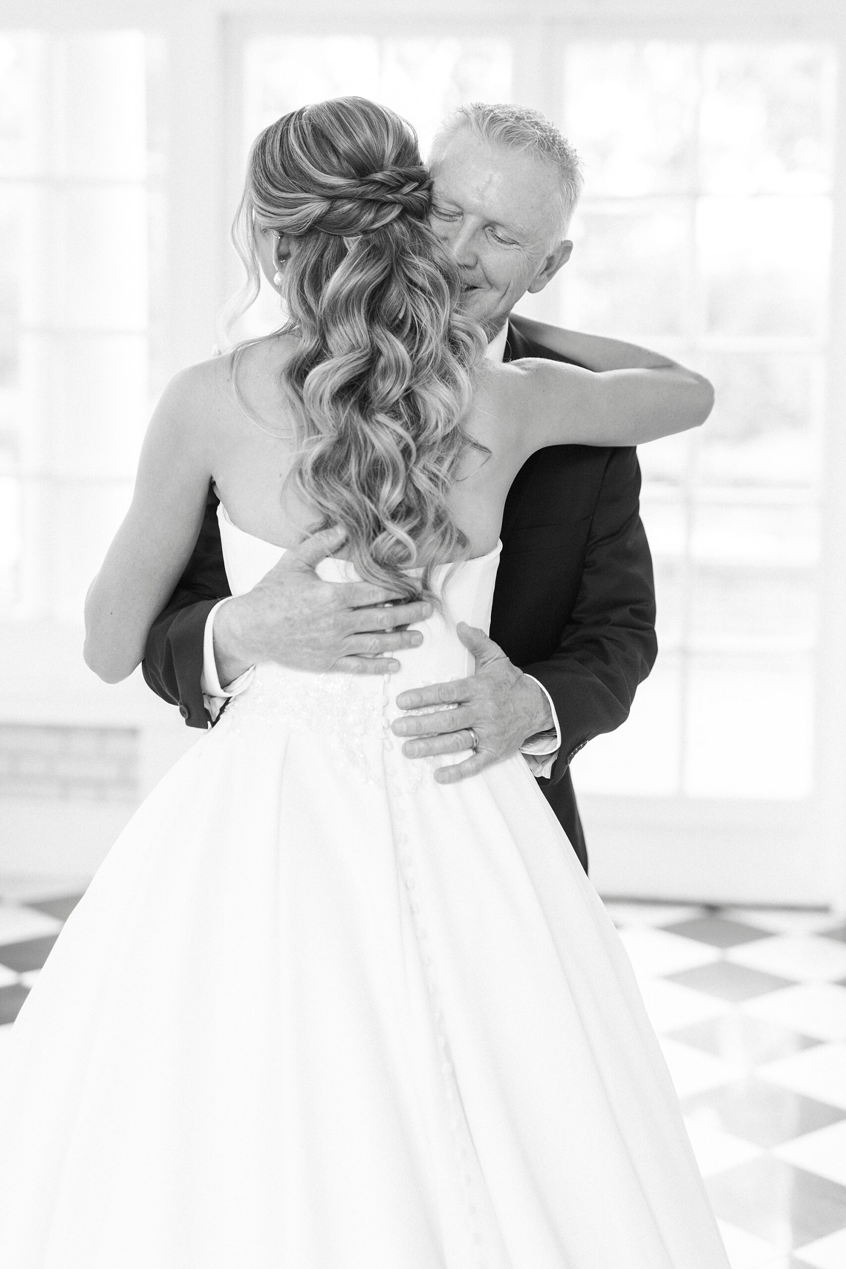 father hugs bride during first look at Separk Mansion