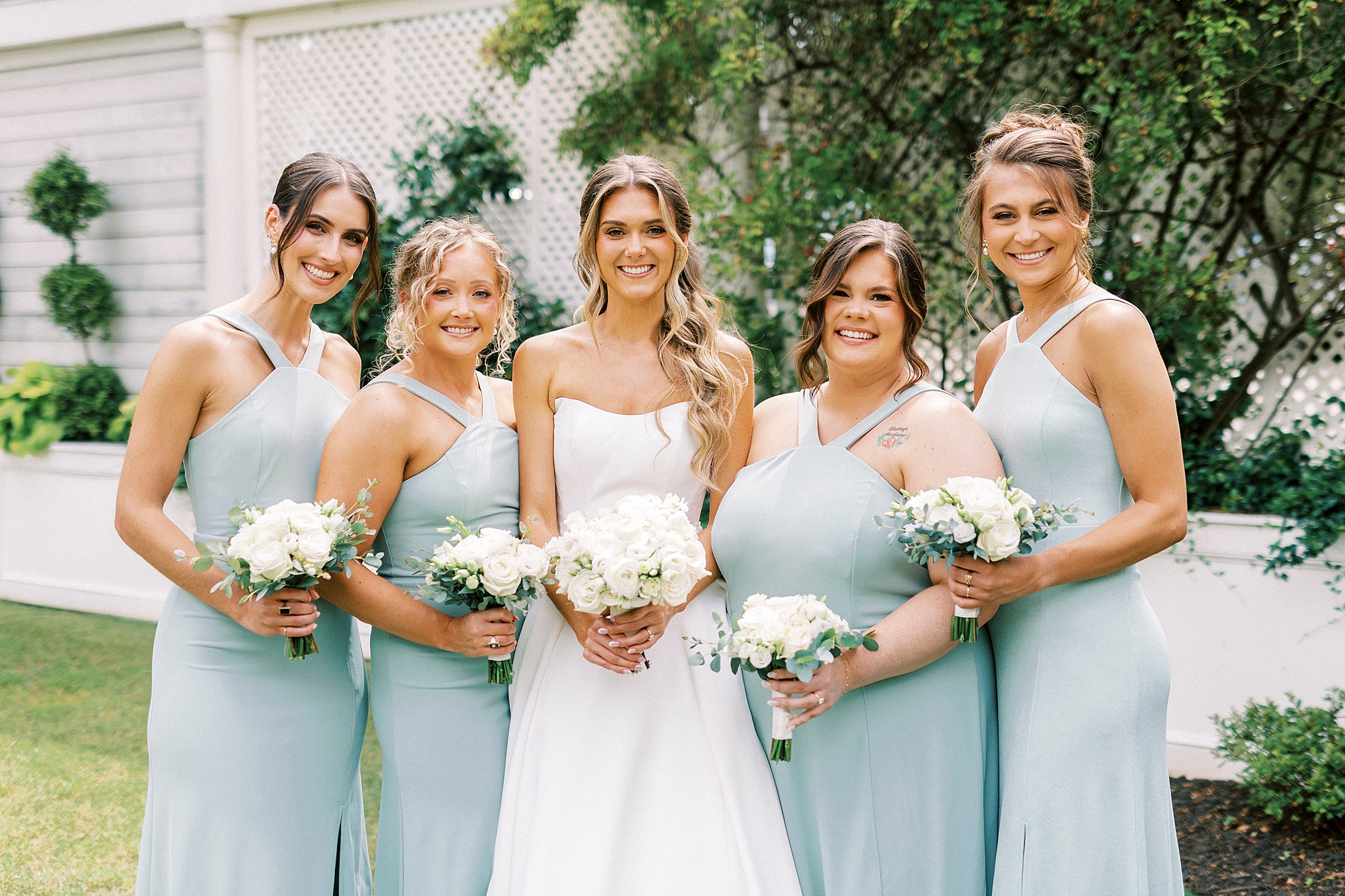 bride stands with bridesmaids in robin's egg blue gowns at Separk Mansion