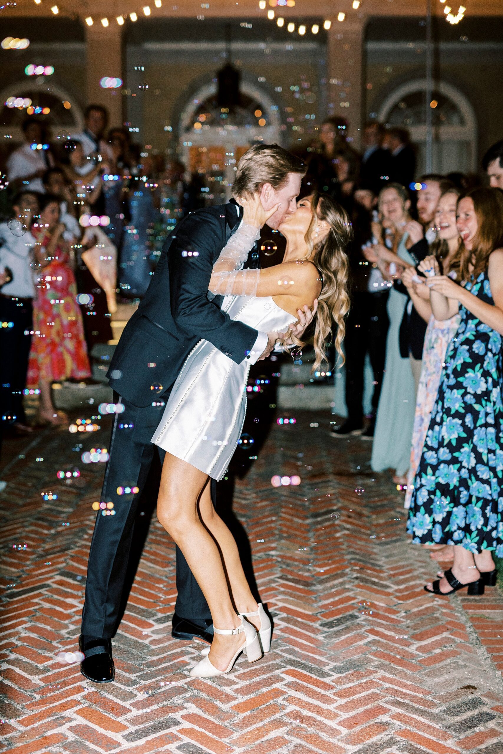 newlyweds kiss during bubble exit from NC reception 