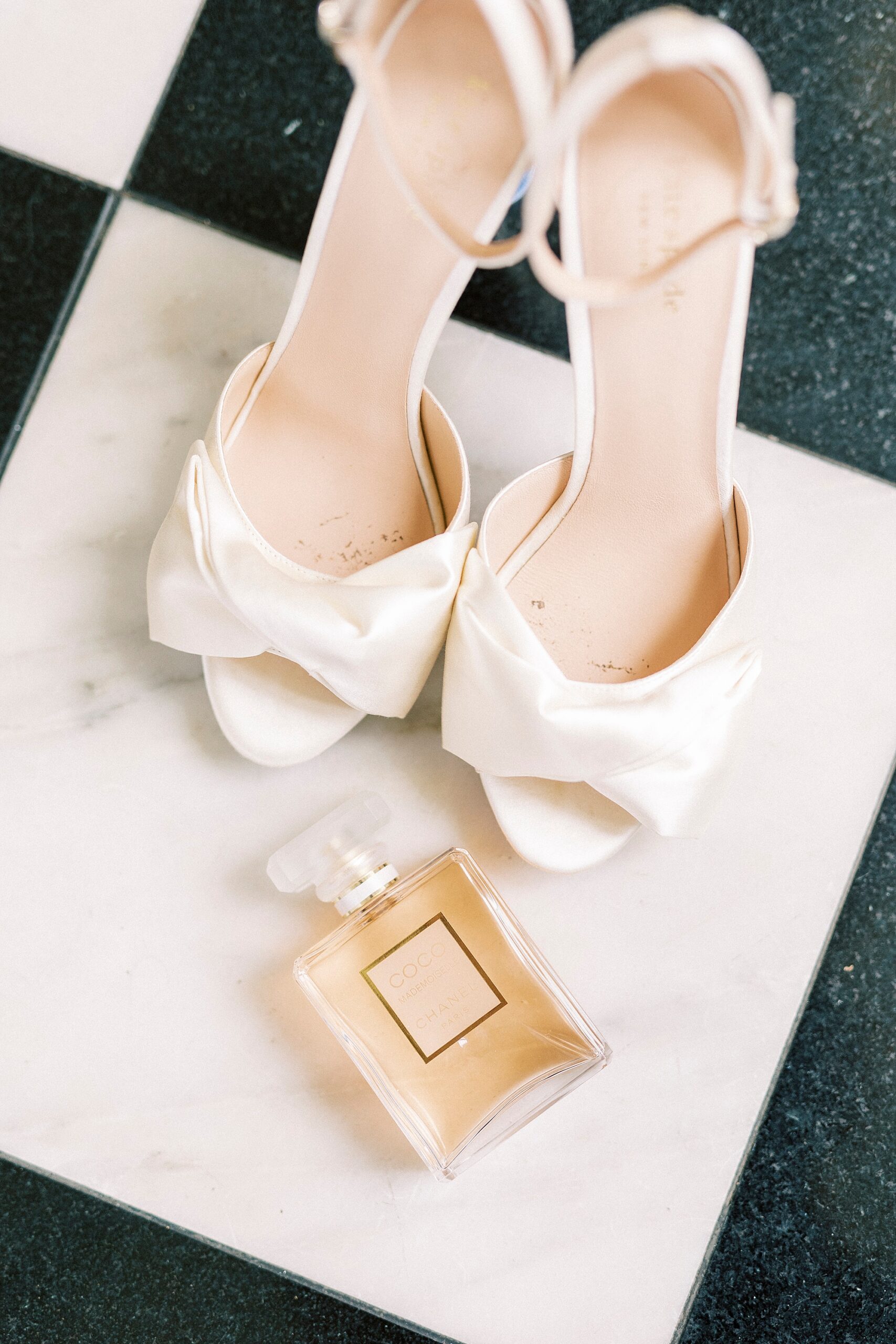 bride's white shoes and perfume for spring wedding at Separk Mansion