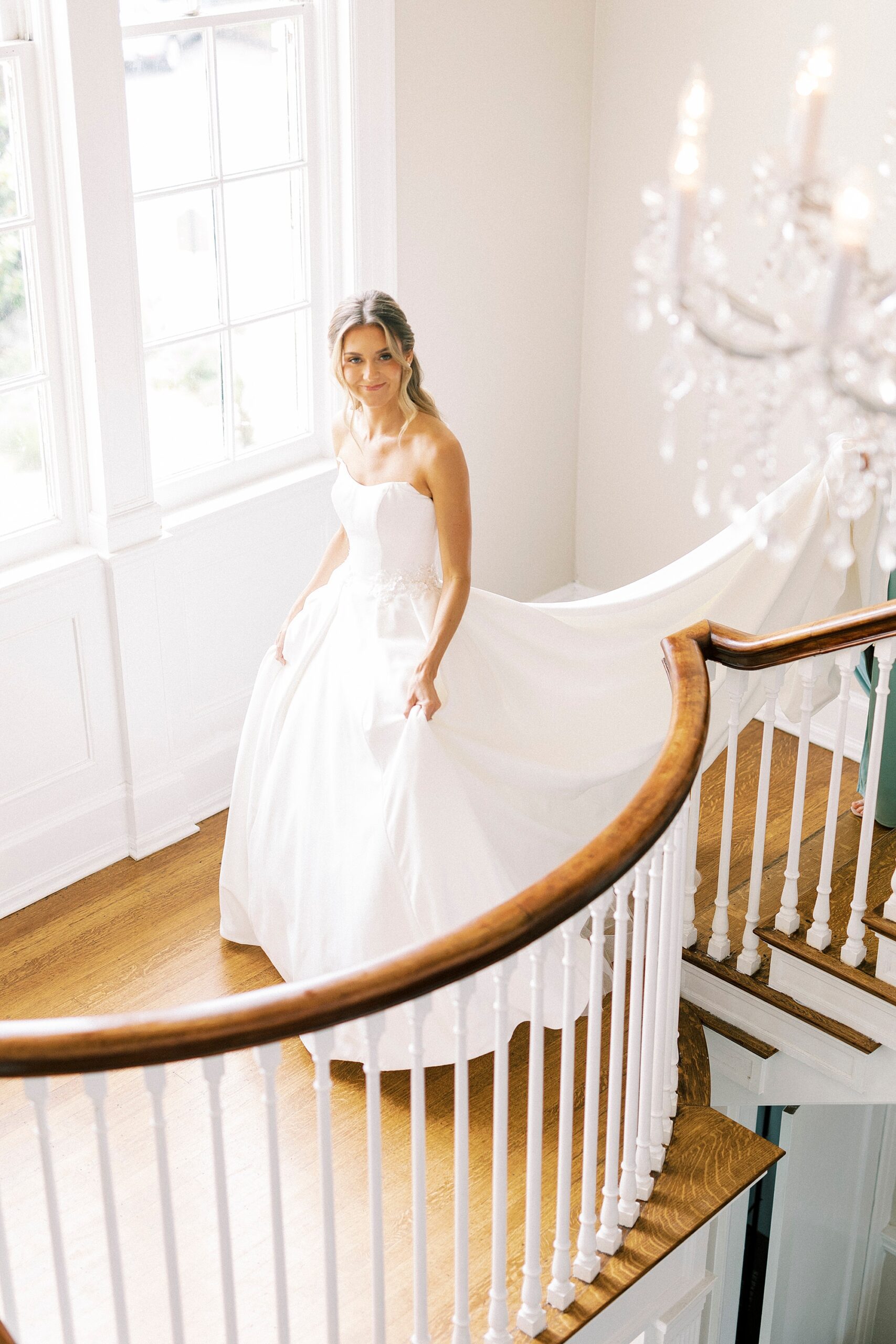 bride walks down staircase inside Separk Mansion