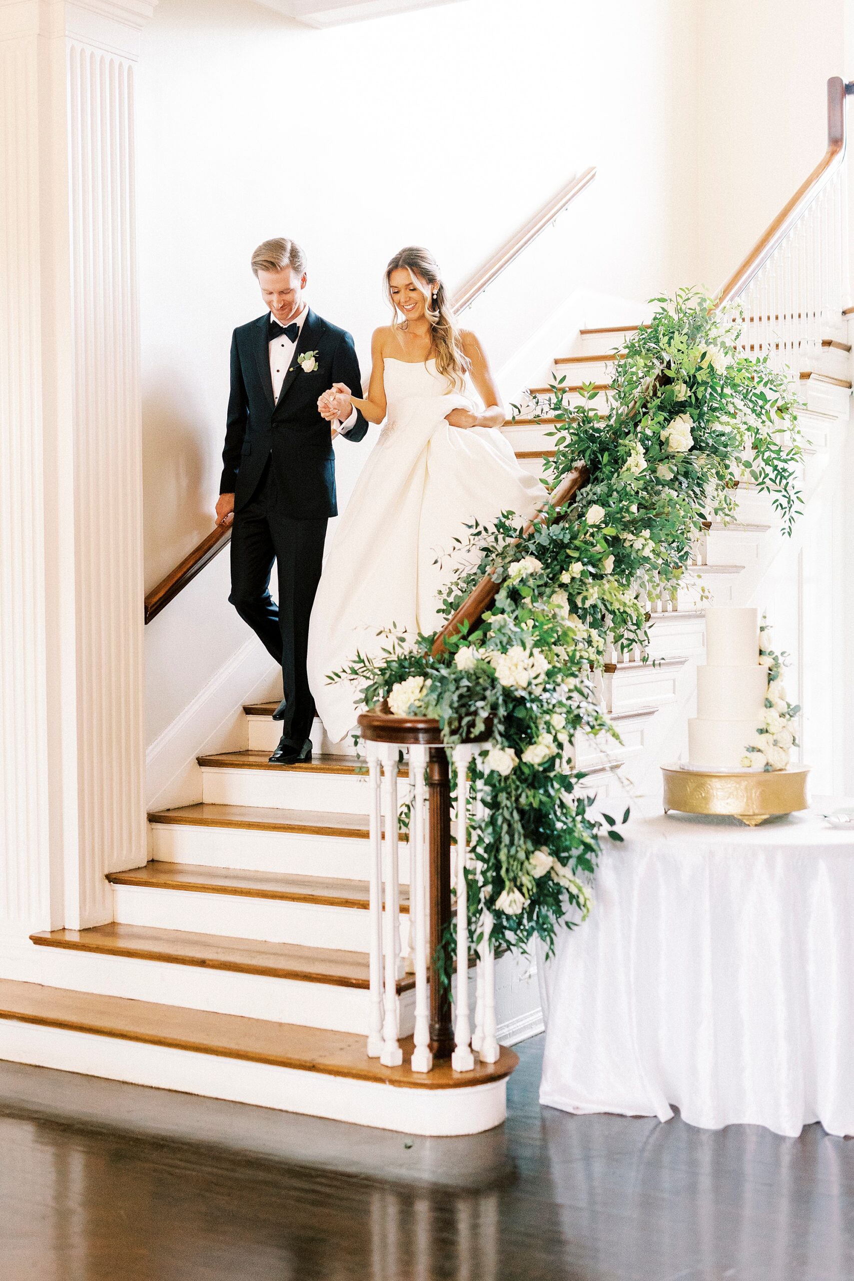 bride and groom walk down steps into reception at Separk Mansion