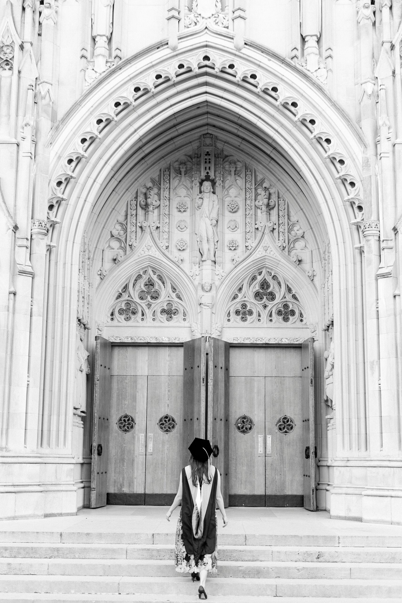 graduate walks towards chapel doors at Duke University