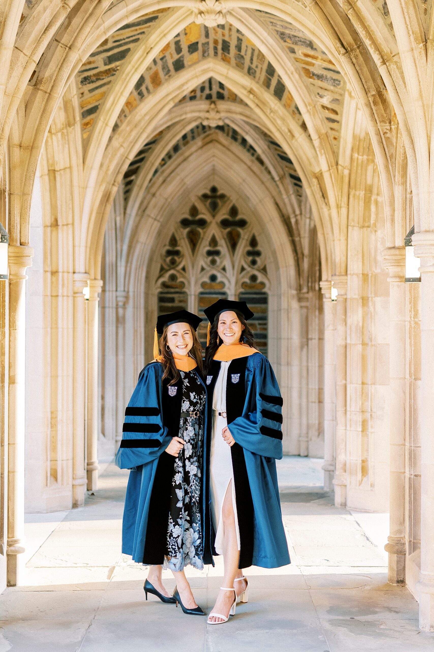 women hug outside chapel at Duke University