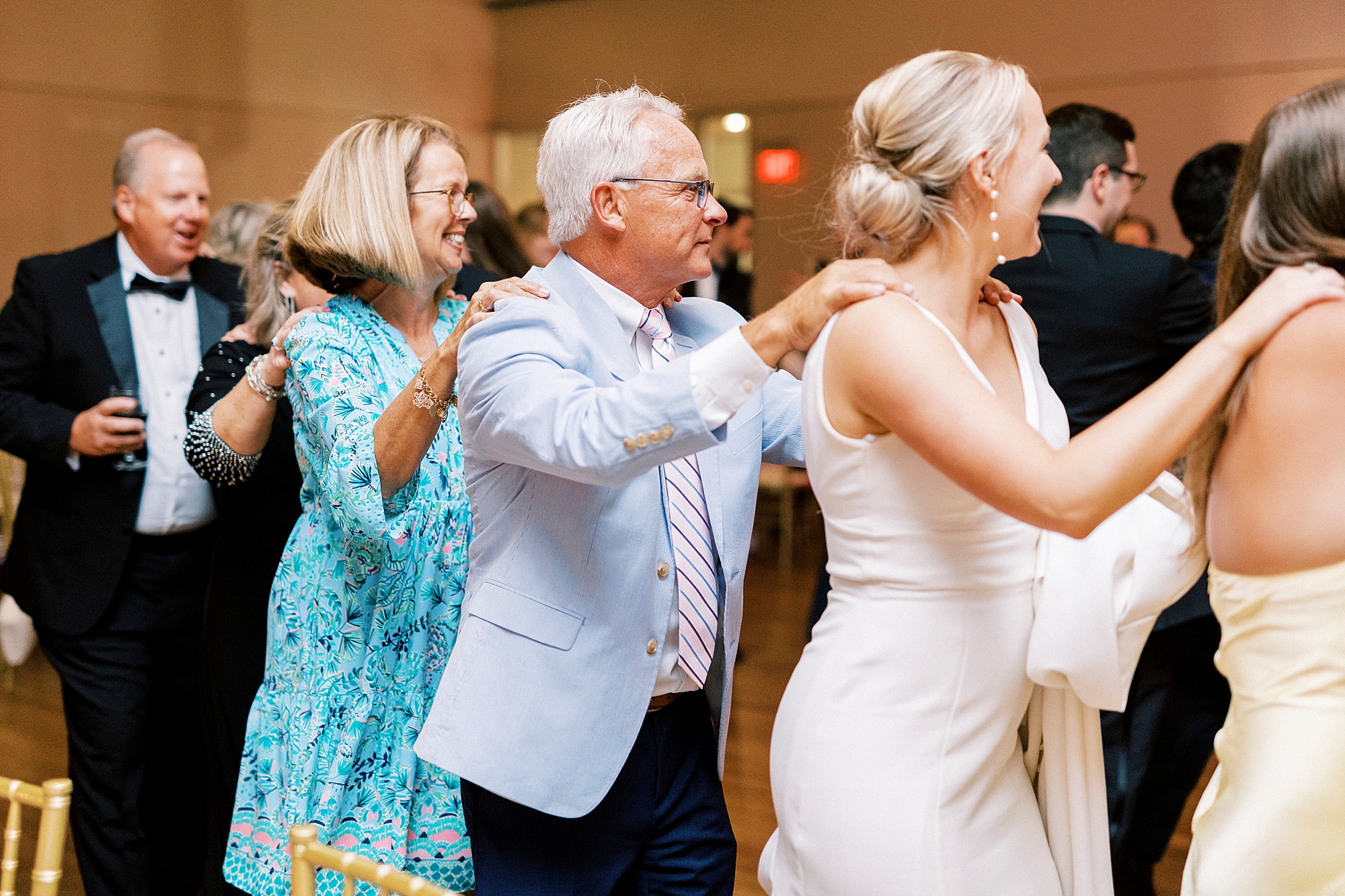 wedding guests do conga line behind bride