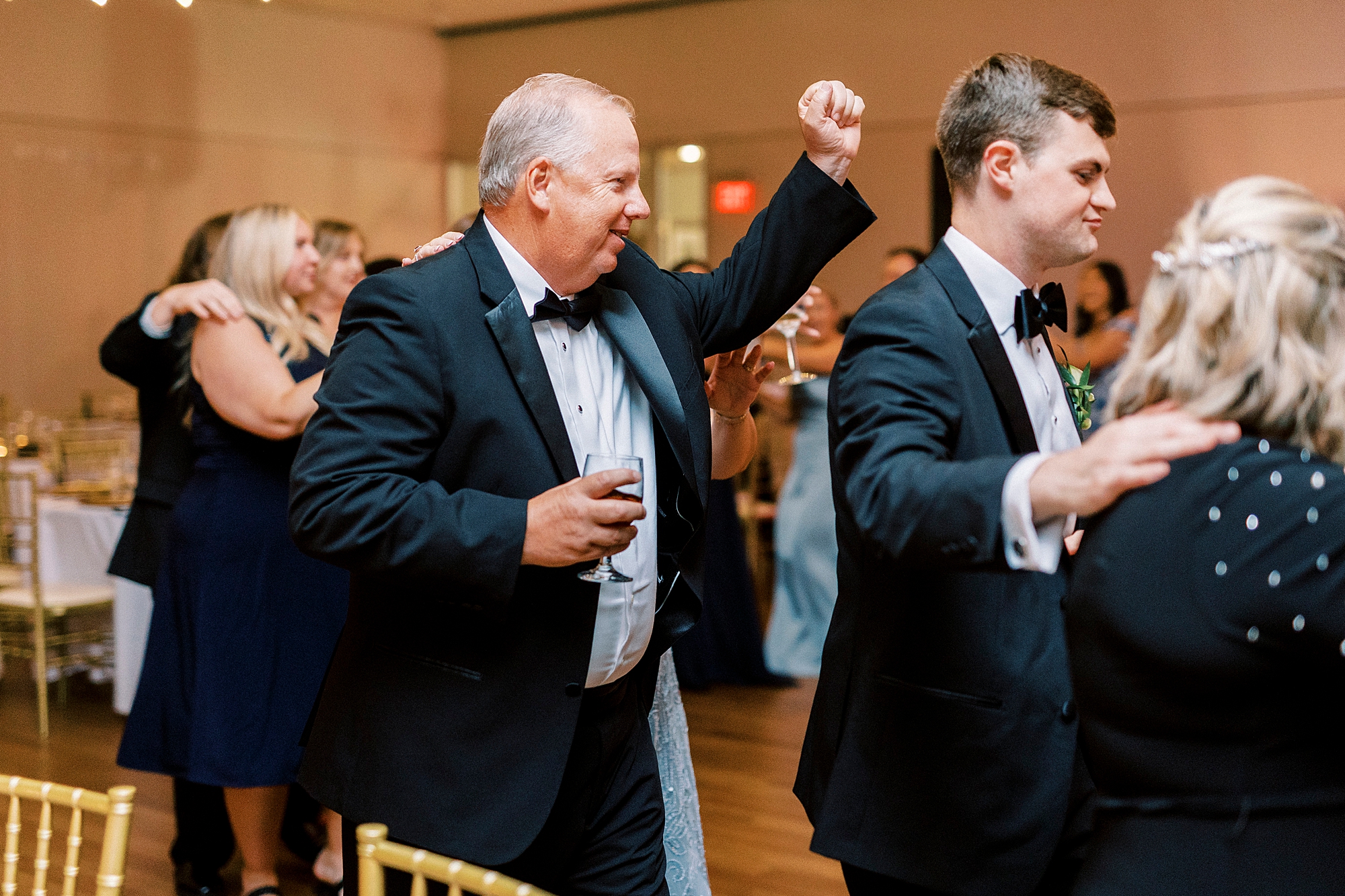 wedding guests dance during reception at the Mint Museum Uptown