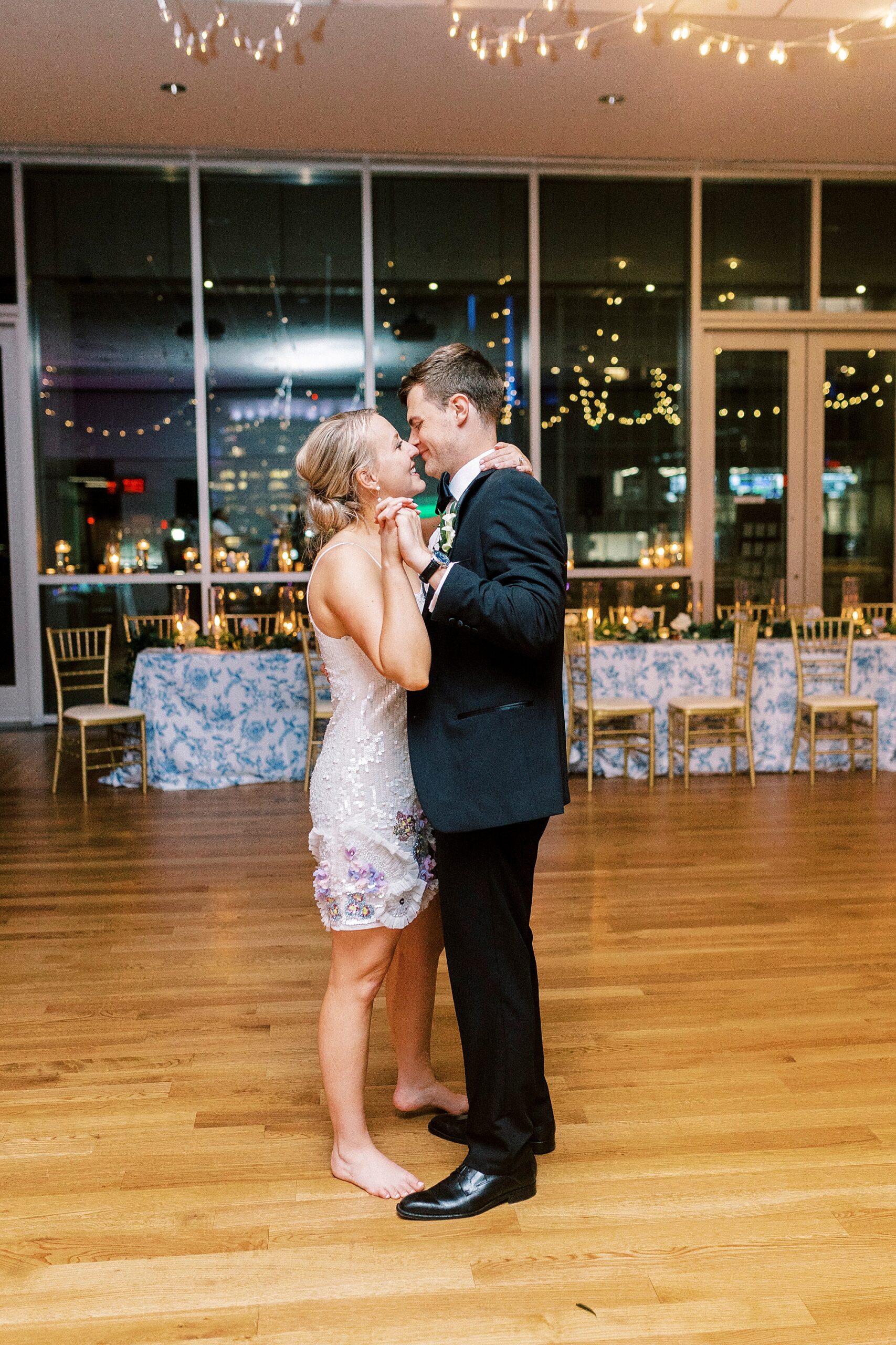 newlyweds kiss during dance at the Mint Museum Uptown