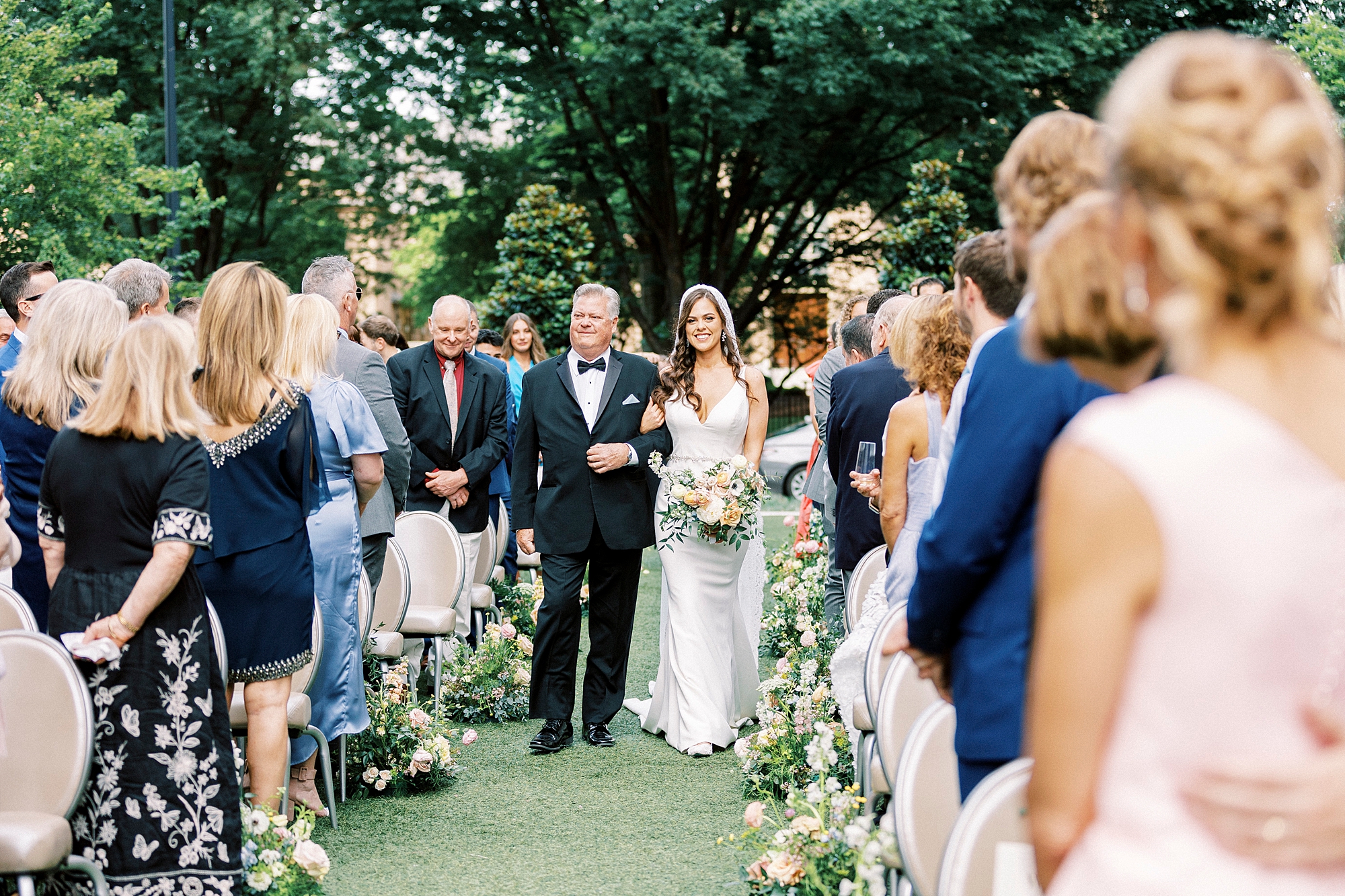 father walks bride down aisle at Grand Bohemian Hotel in Charlotte NC