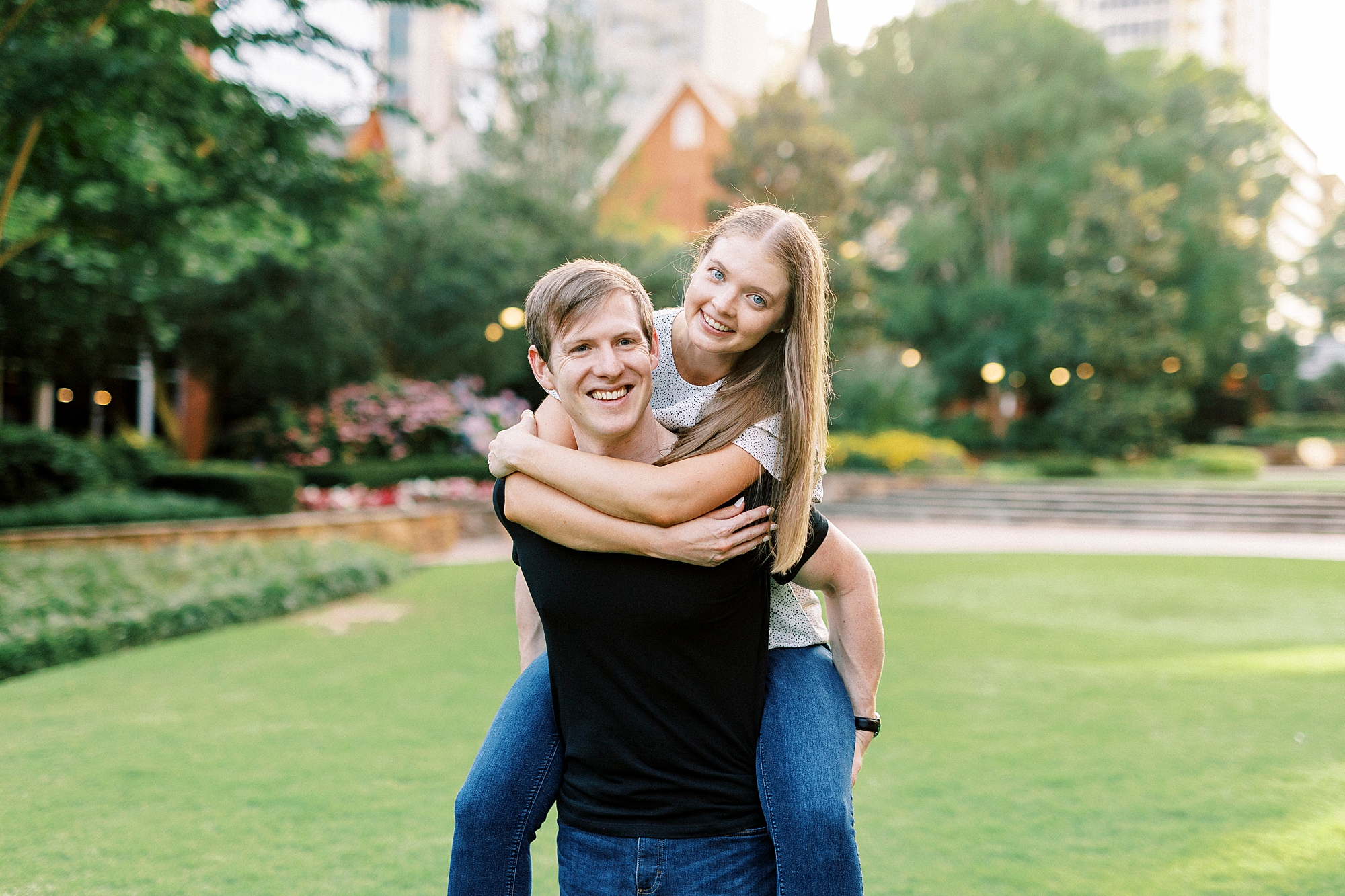 woman hugs man around shoulders during piggy back ride
