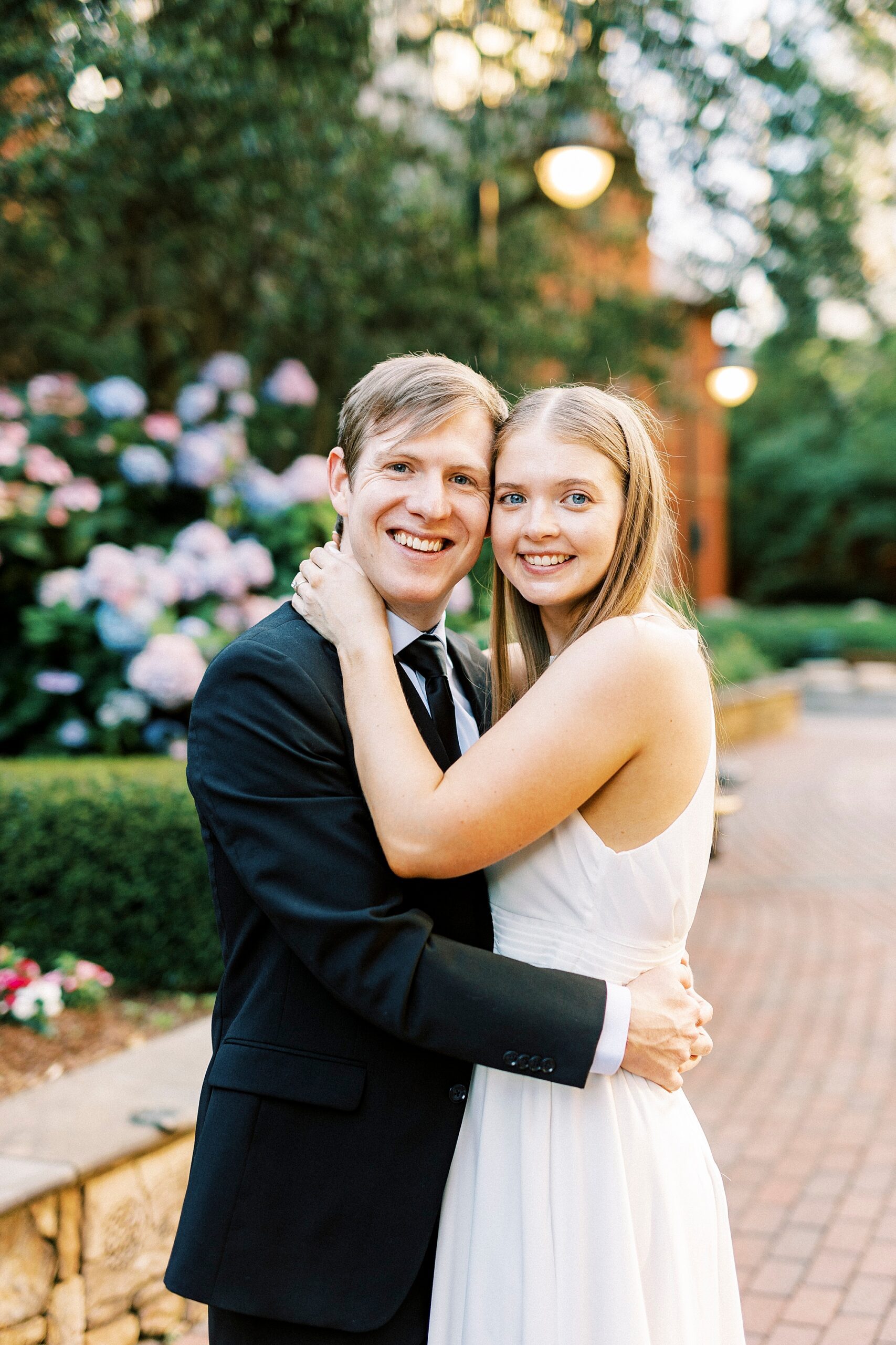 man and woman hug leaning heads together in Charlotte NC