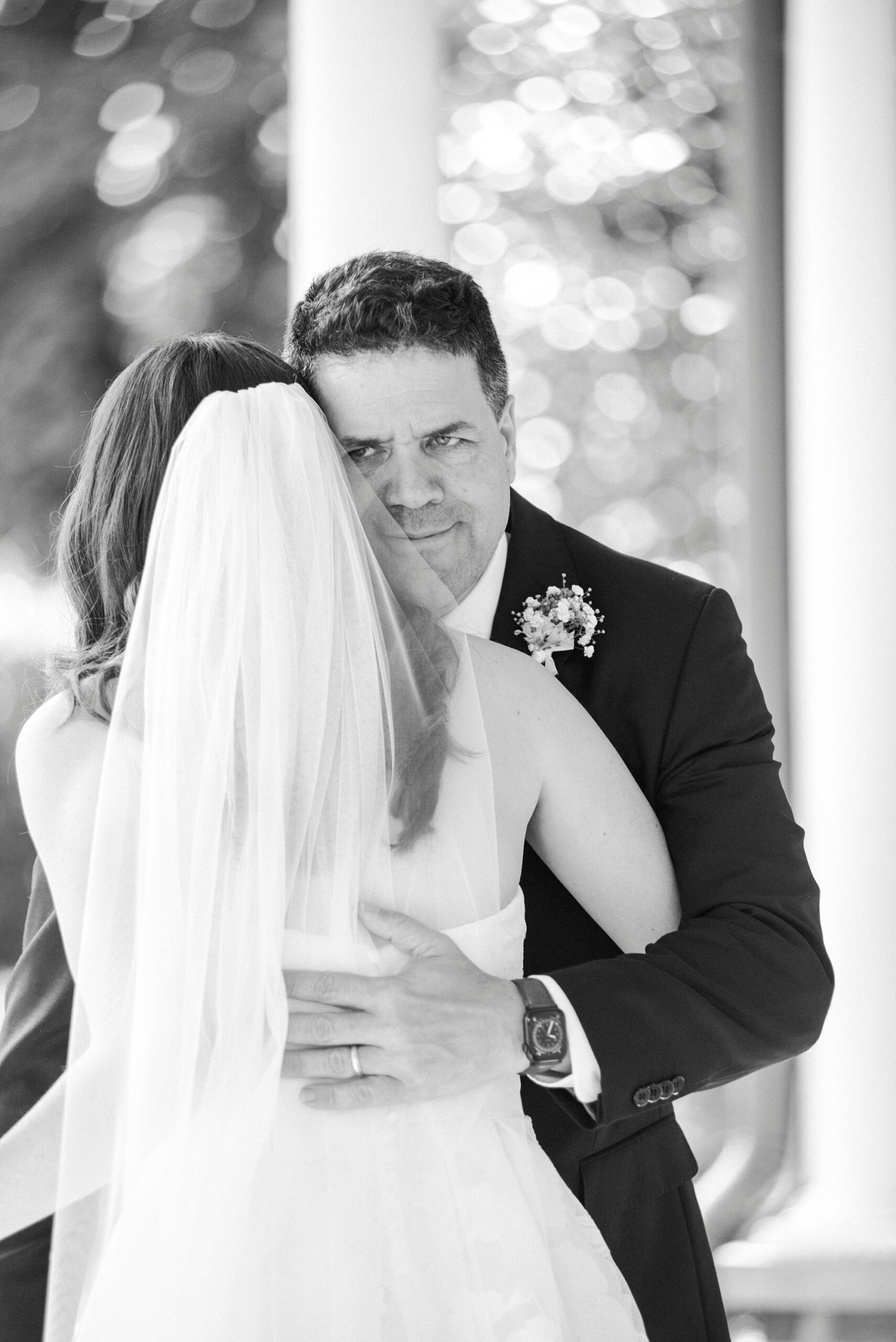 father hugs bride during first look at Alexander Homestead