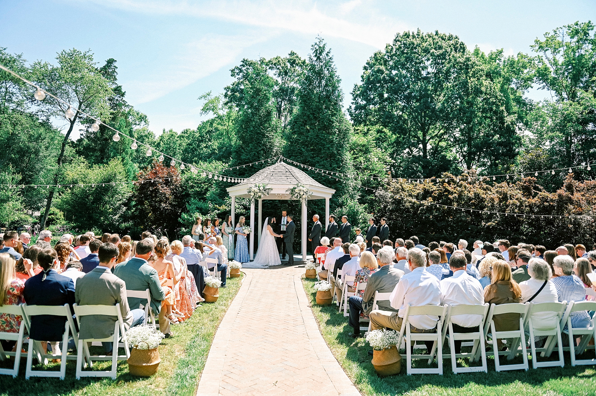wedding ceremony in the garden of Alexander Homestead at the gazebo