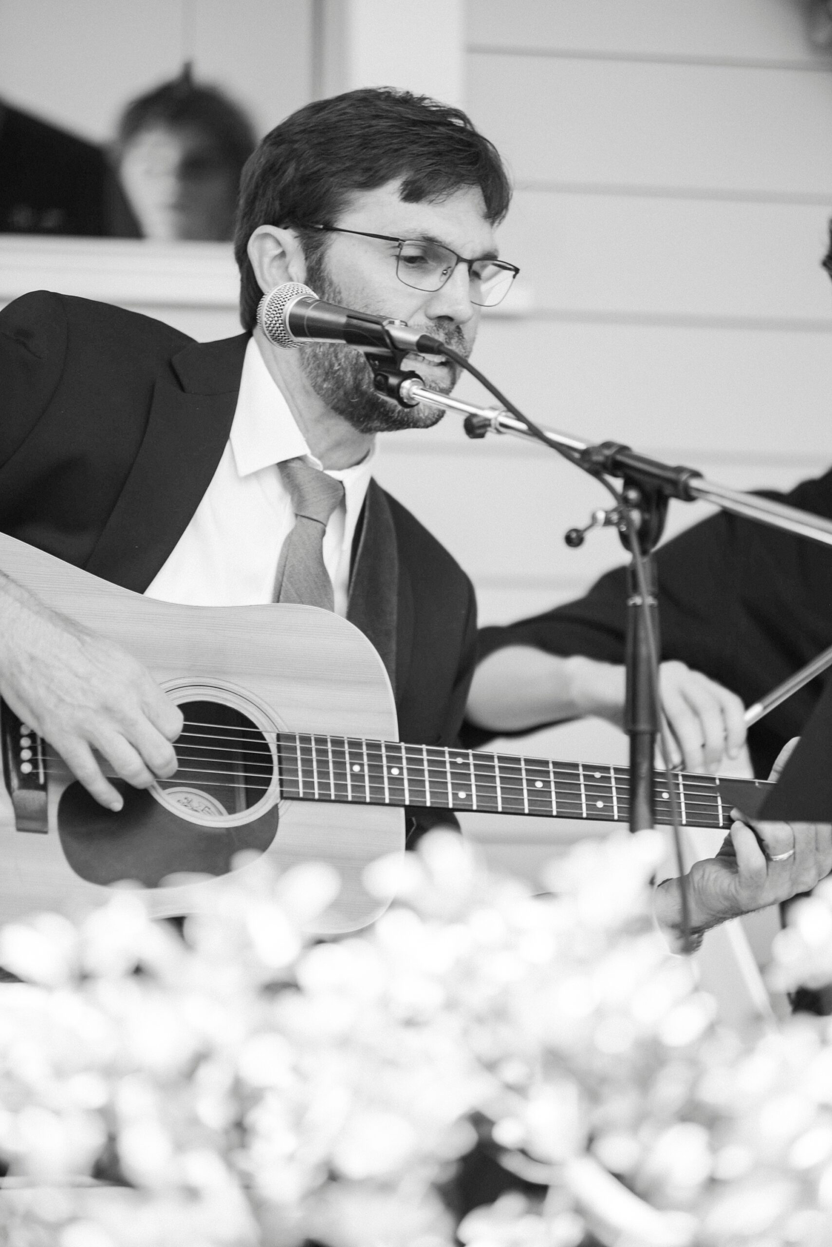 man plays guitar during wedding ceremony at Alexander Homestead