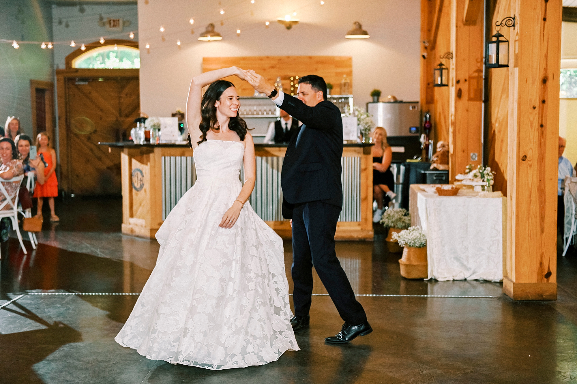 father twirls bride during reception dance at Alexander Homestead