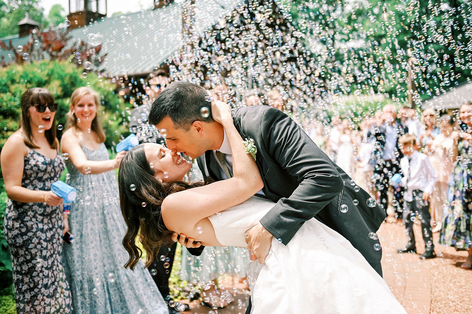 newlyweds kiss during bubble exit from Charlotte NC reception