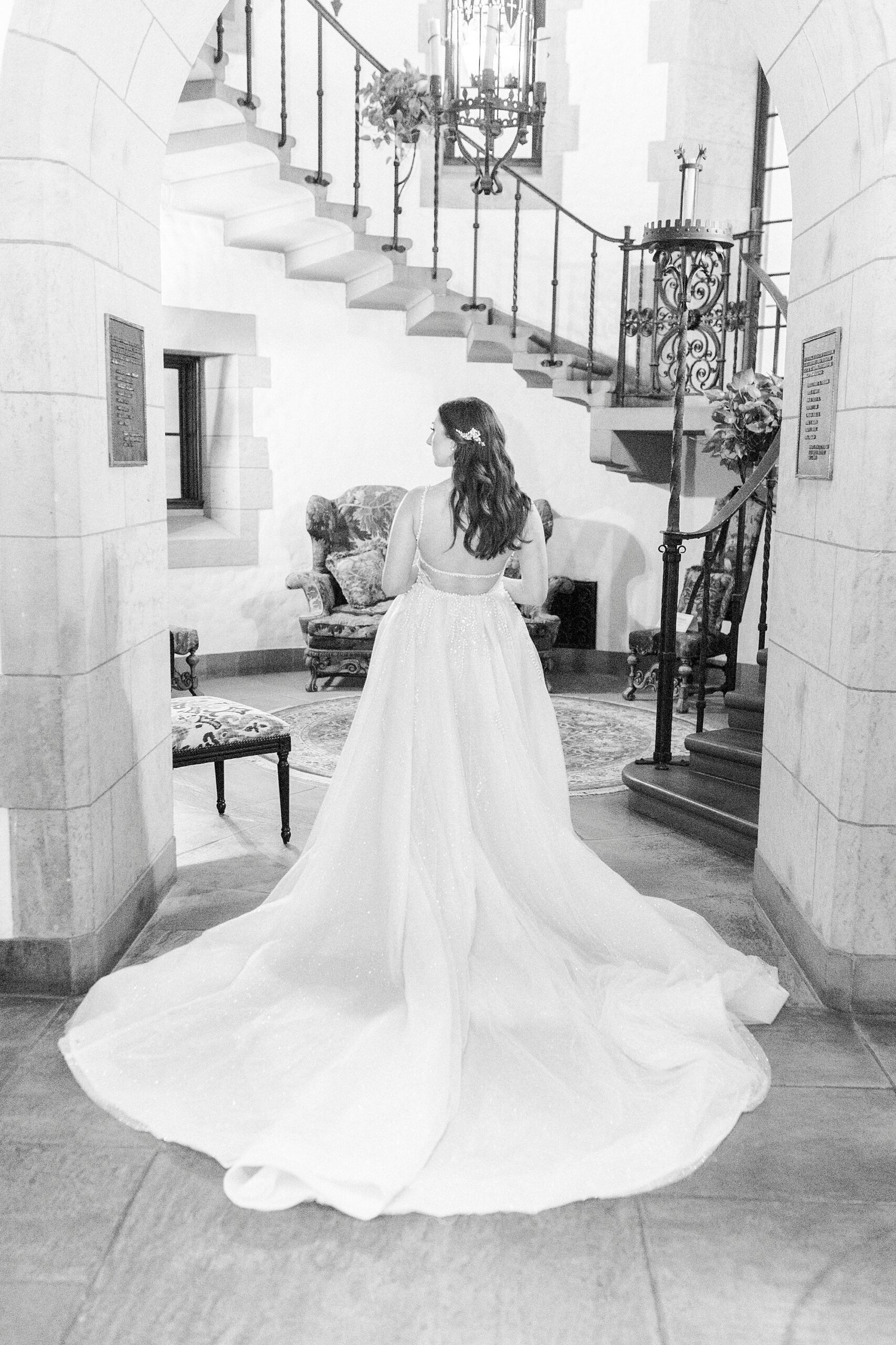 bride stands in the doorway of the lobby at the Graylyn Estate